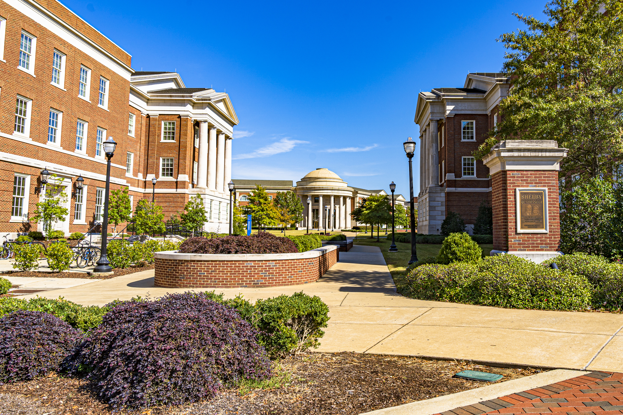 Buildings surrounding the Shelby Quadrangle at the University of Alabama in Tuscaloosa, on a sunny spring day.