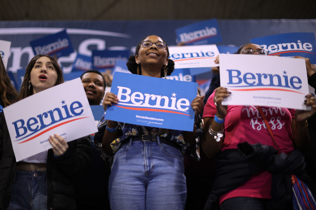 Student supporters listen to US Democratic presidential candidate Senator Bernie Sanders during a campaign rally.