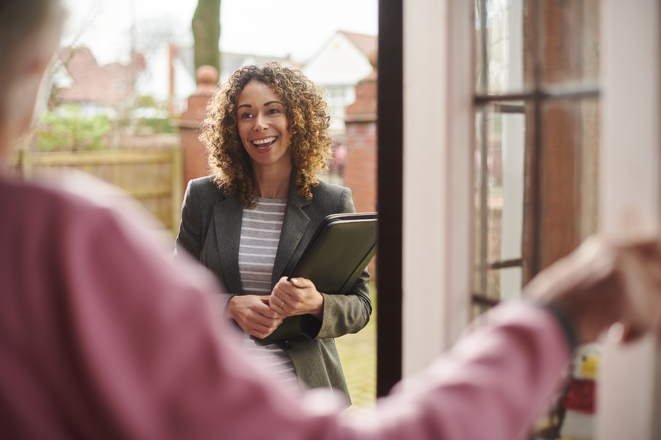 Social worker paying a visit to a client's home.