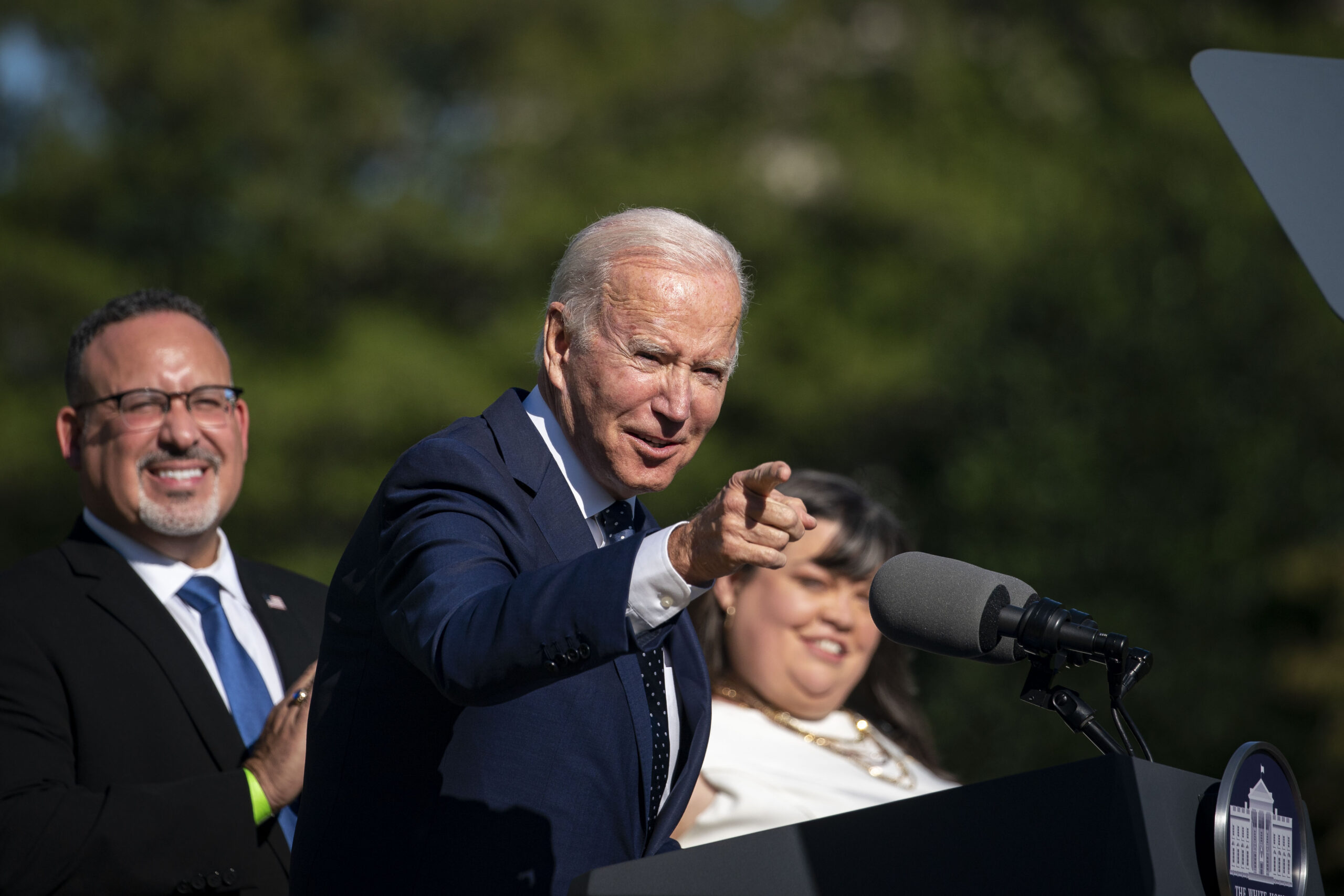 U.S. President Joe Biden speaks as Miguel Cardona, U.S. secretary of education, listens during the Council of Chief State School Officers' 2020 and 2021 State and National Teachers of the Year event