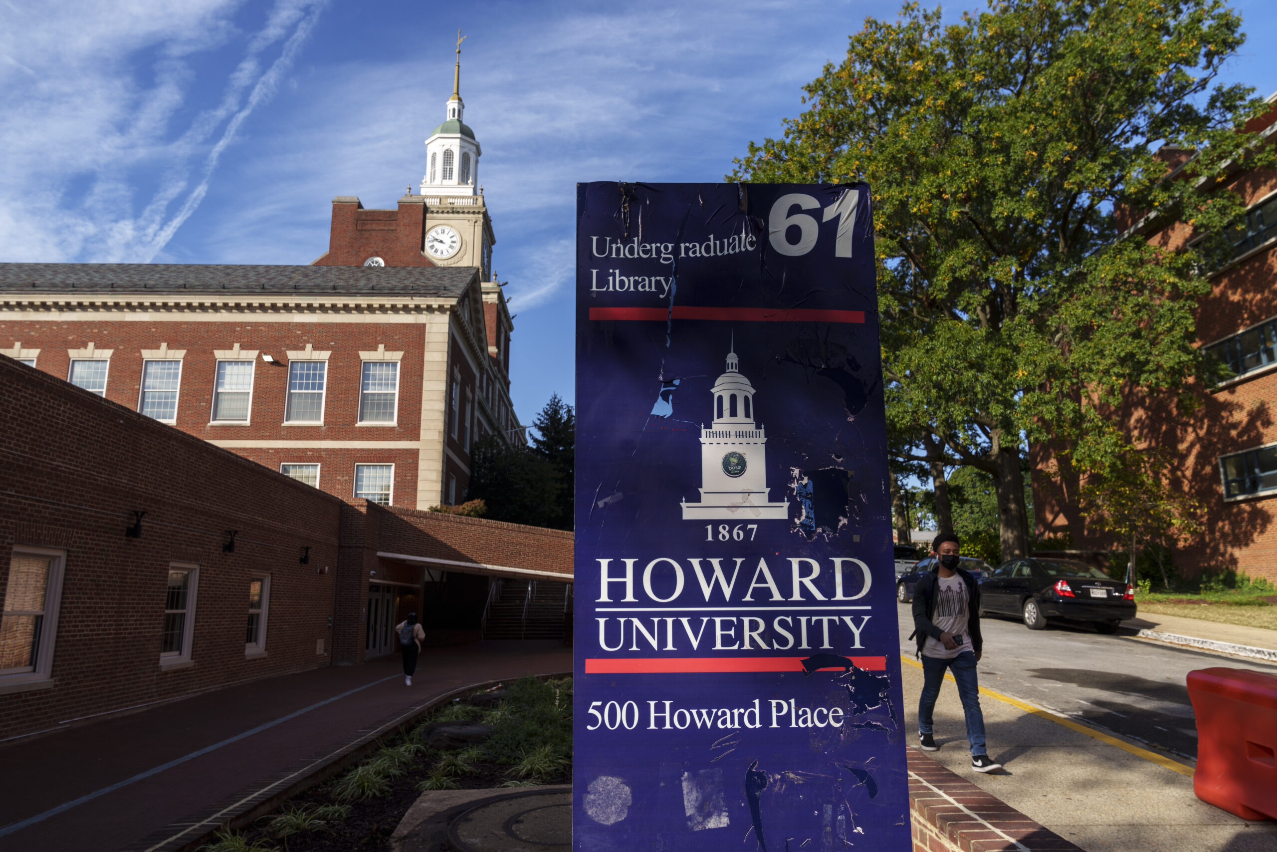 A student walks along the Howard University campus