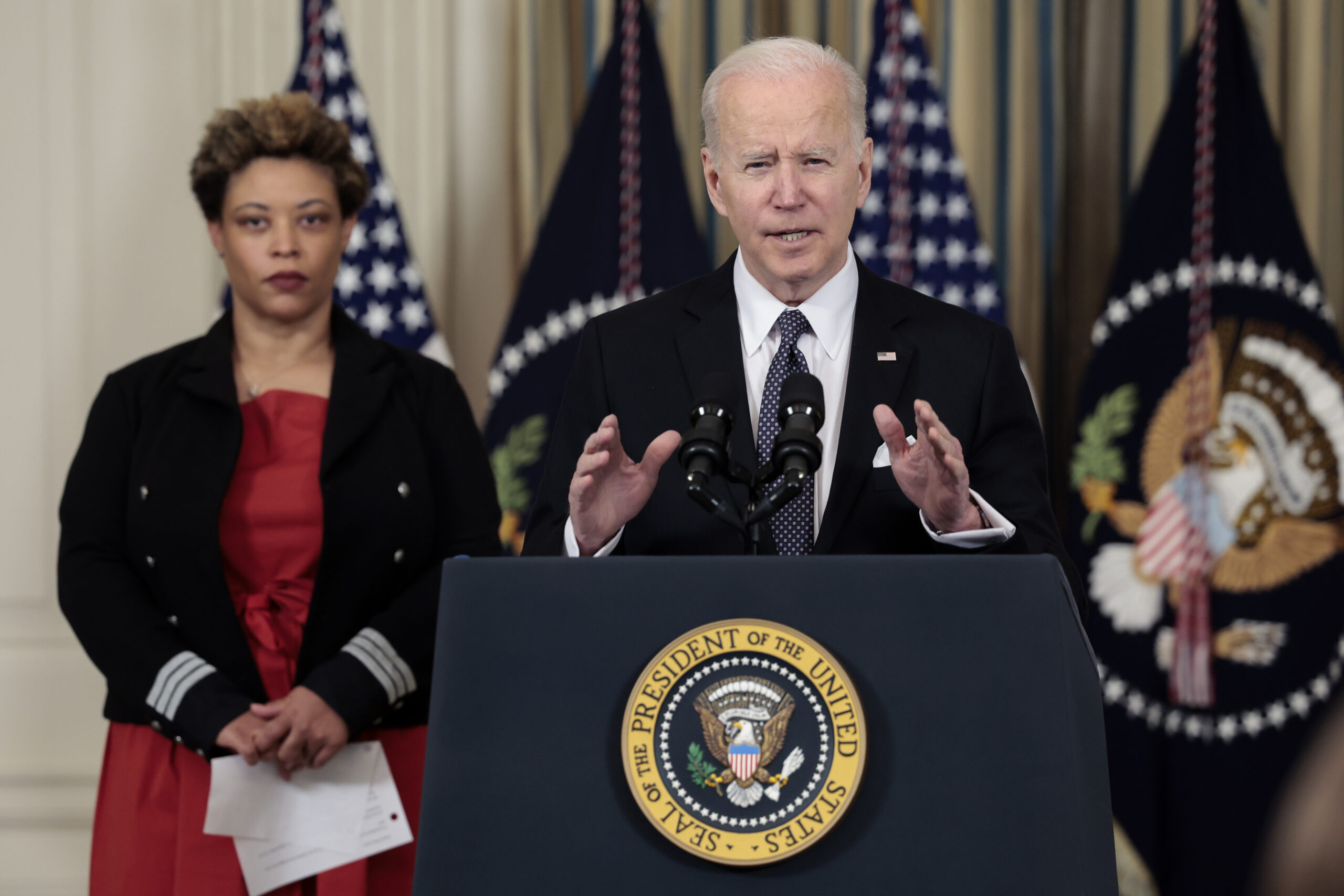 U.S. President Joe Biden speaks along side Director of the Office of Management and Budget Shalanda Young as he introduces his budget request for fiscal year 2023 in the State Dining Room of the White House