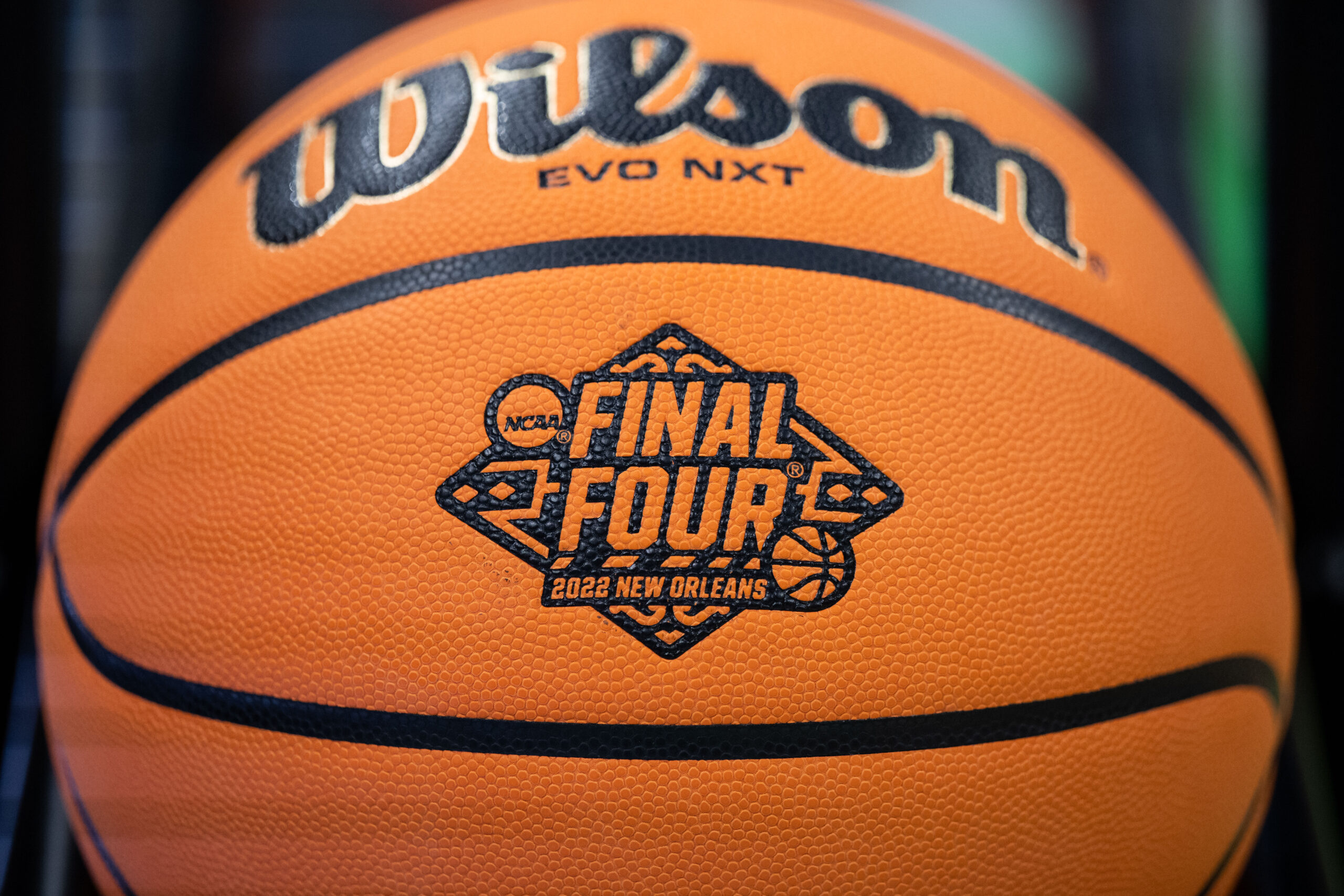 A close up picture of a basketball with the New Orleans Final Four logo