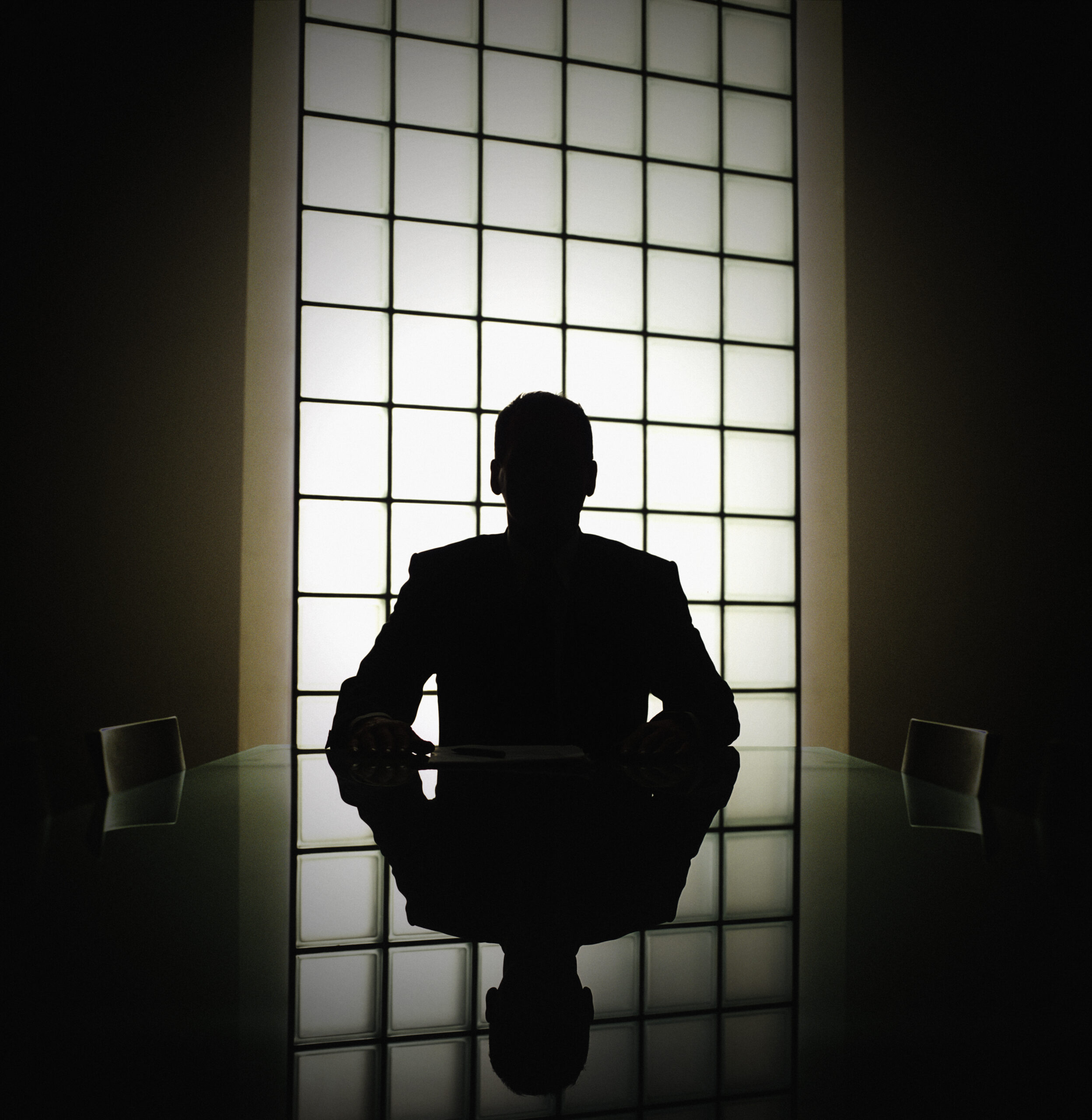 Business man or boss in silhouette interview