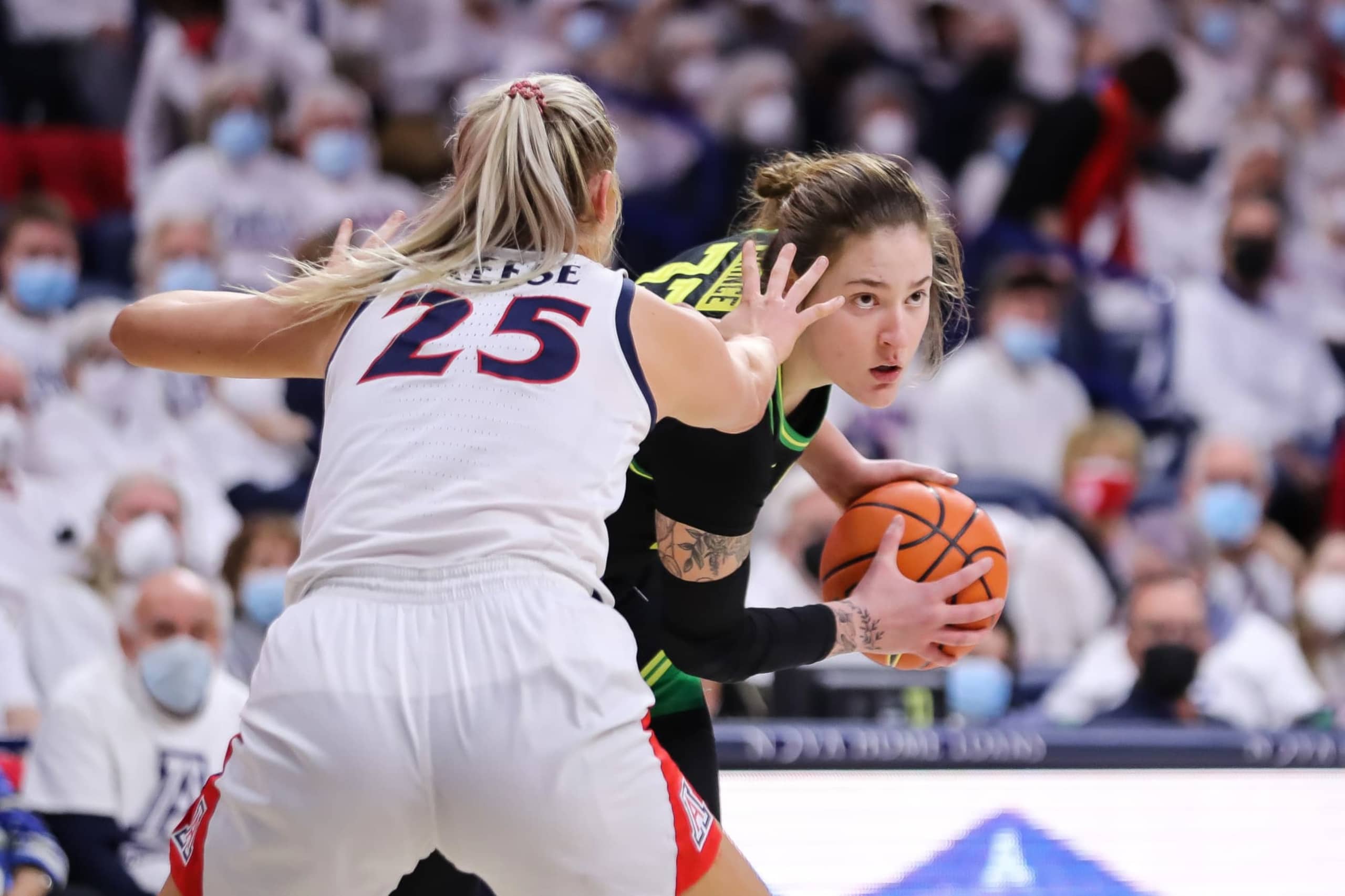 Forward Sedona Prince #32 of the Oregon Ducks looks for an open teammate against forward Cate Reese #25 of the Arizona Wildcats during the NCAAW game at McKale Center on February 04, 2022 in Tucson, Arizona