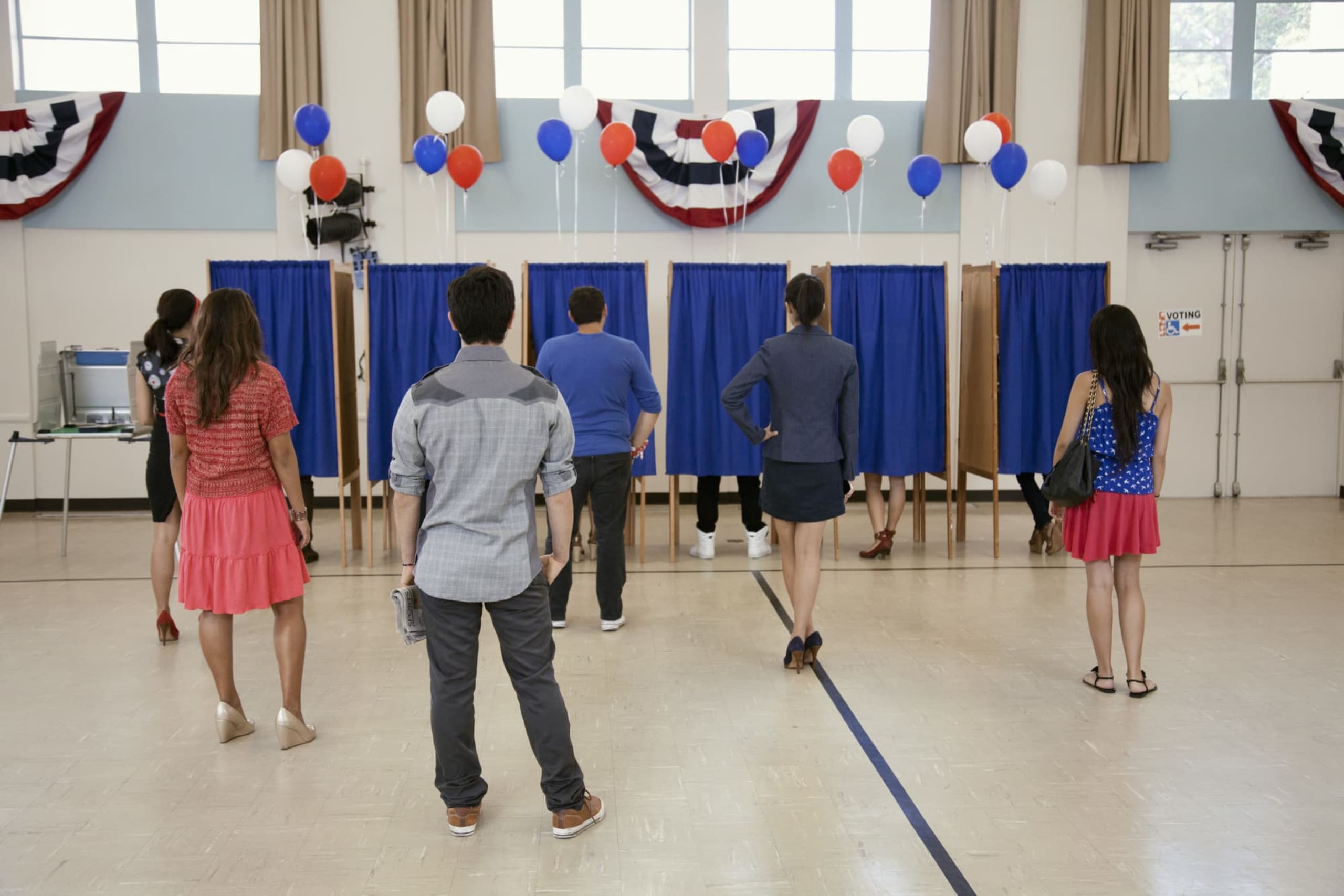 Voters waiting to vote in polling place