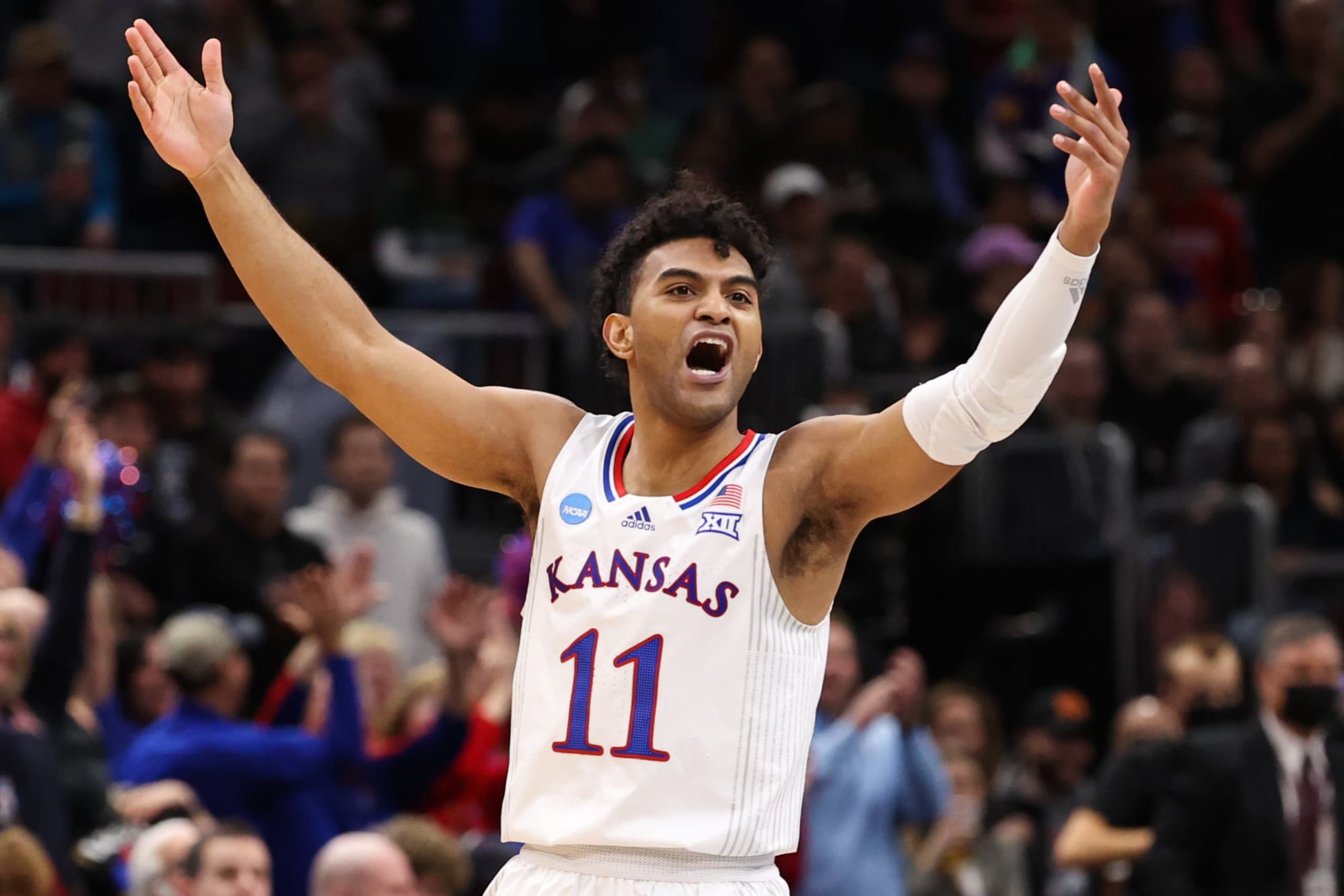 Remy Martin #11 of the Kansas Jayhawks reacts against the Miami (Fl) Hurricanes during the Elite Eight round of the 2022 NCAA Mens Basketball Tournament