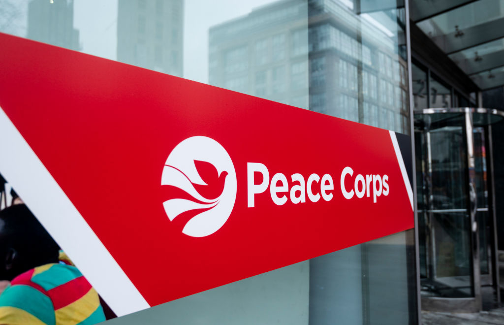 A sign marking the entrance to the Peace Corps headquarters in Washington, DC.