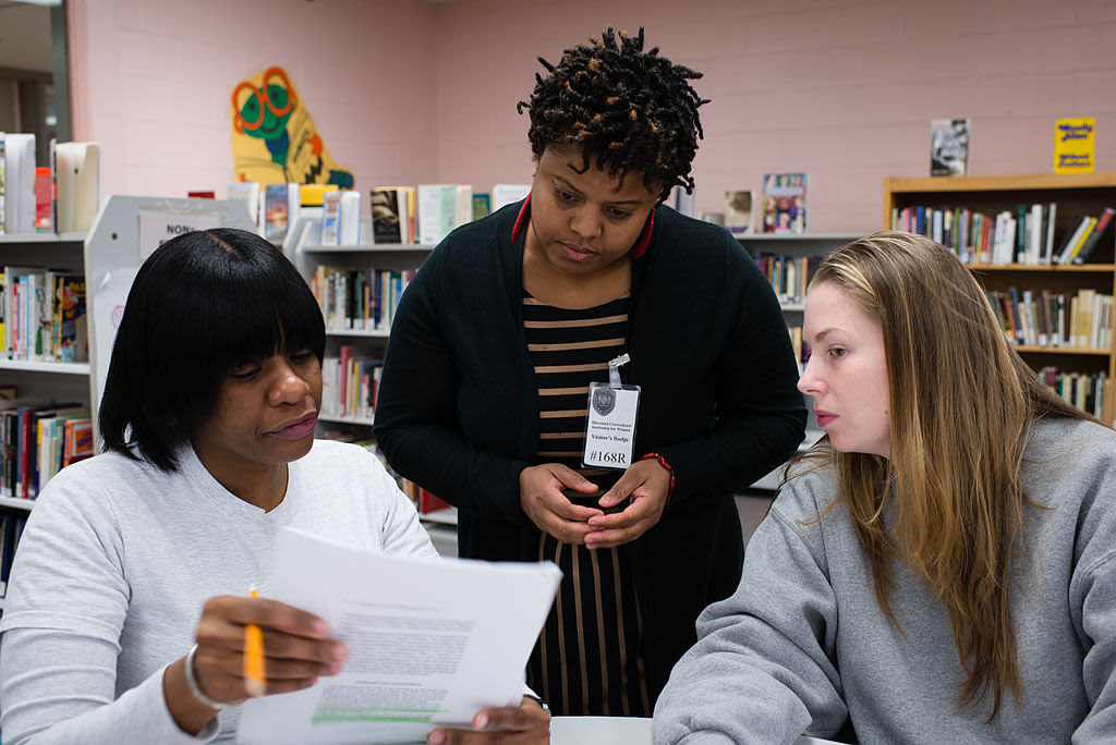 Female inmates at the Maryland Correctional Institution for Women in Jessup, Maryland, participate in a college class sponsored by Goucher College's prison education program.