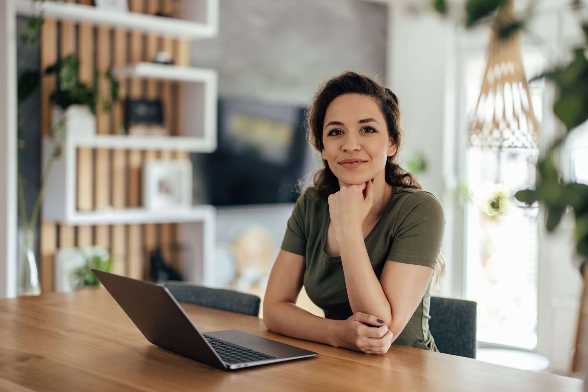 Portrait of young woman getting ready to study online