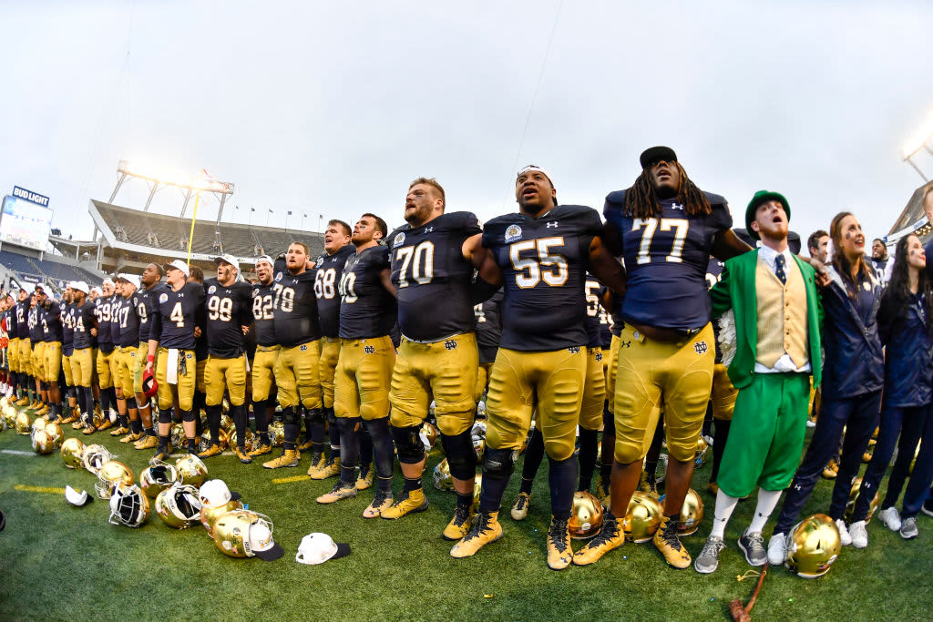 ORLANDO, FL - JANUARY 01: Notre Dame players sing their fight song after the victory ceremony of the Citrus Bowl game between the Notre Dame Fighting Irish and the LSU Tigers on January 01, 2018, at Camping World Stadium in Orlando, FL. Notre Dame defeated LSU 21-17.