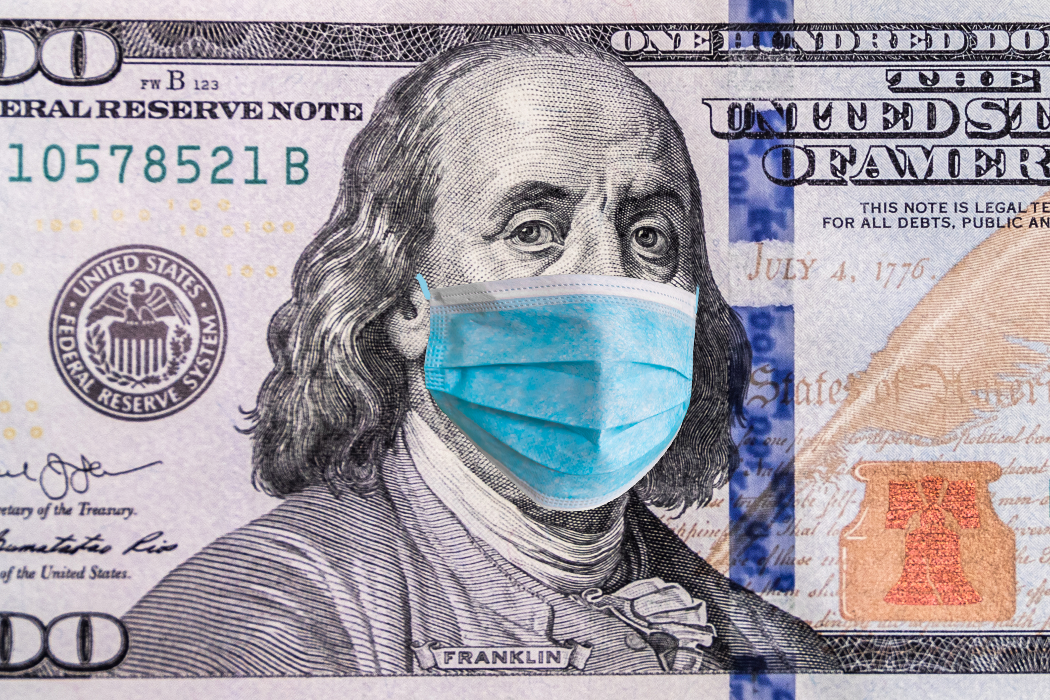 Coronavirus Wuhan. US quarantine, 100 dollar banknote with medical mask. The concept of epidemic and protection against coronavrius.