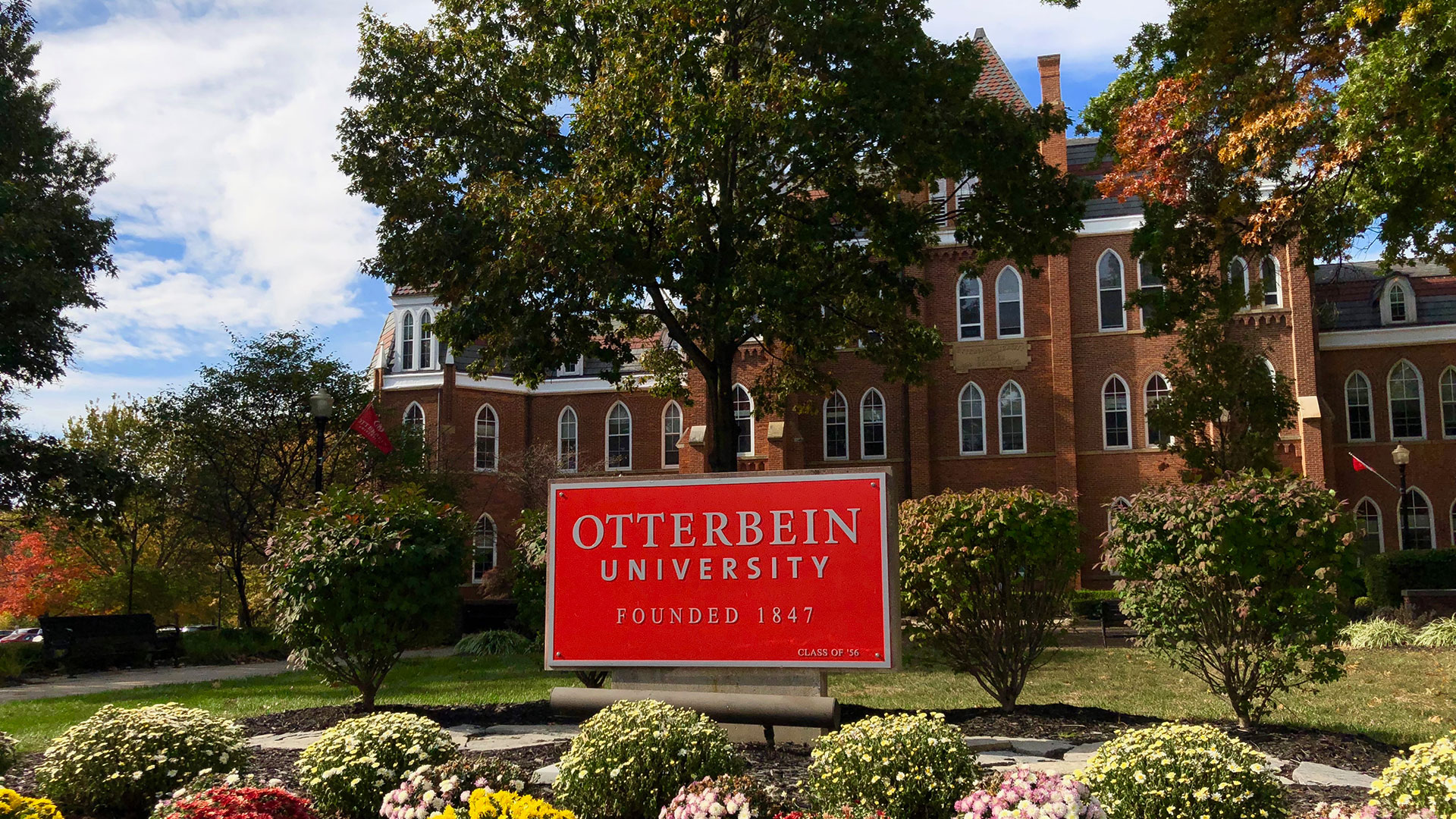 Sign out front of a building at Otterbein University's campus