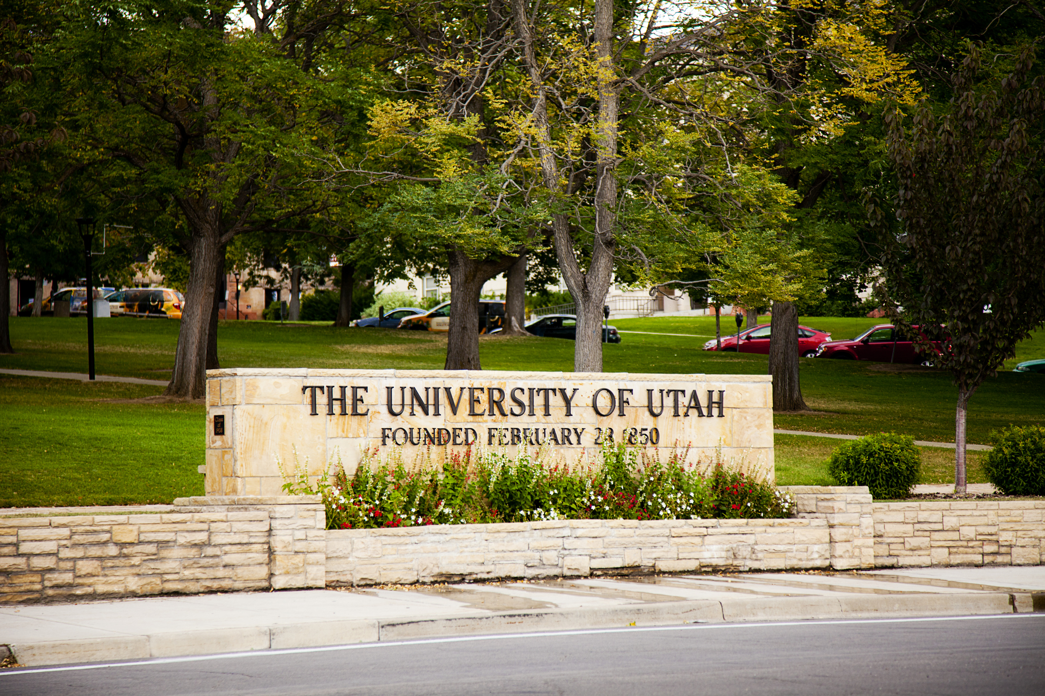 "Late summer setting of one of the gateway entrances to the University of Utah--this one at the top of 2nd South Street in Salt Lake City, Utah. The landscaped quad and roadway surrounding this sign is known as President's Circle.OTHER IMAGES OF THE UNIVERSITY OF UTAH"