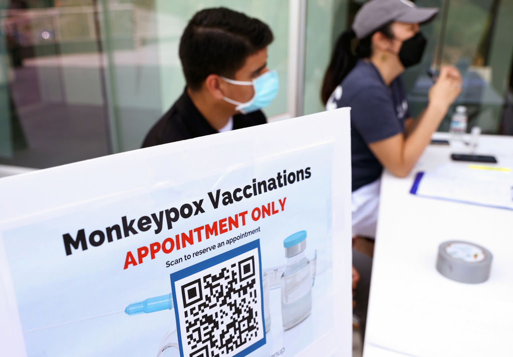 WEST HOLLYWOOD, CALIFORNIA - AUGUST 03: Health workers sit at a check-in table at a pop-up monkeypox vaccination clinic which opened today by the Los Angeles County Department of Public Health at the West Hollywood Library on August 3, 2022 in West Hollywood, California. California Governor Gavin Newsom declared a state of emergency on August 1st over the monkeypox outbreak which continues to grow globally.
