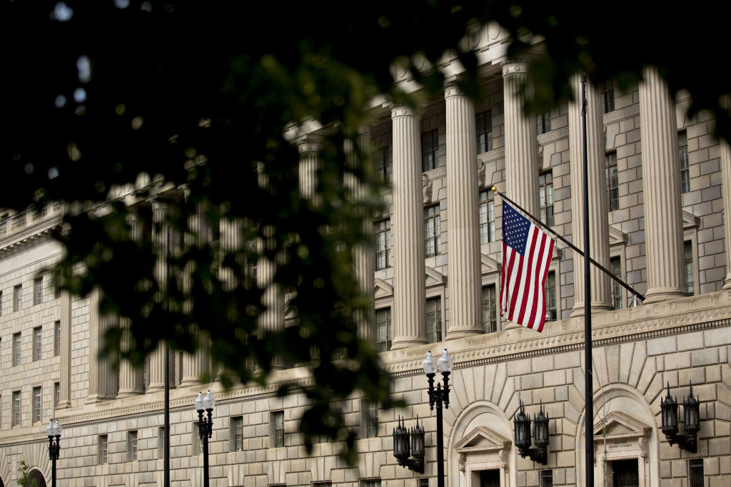 An American flag flies outside the U.S. Department of Commerce headquarters in Washington, D.C., U.S.