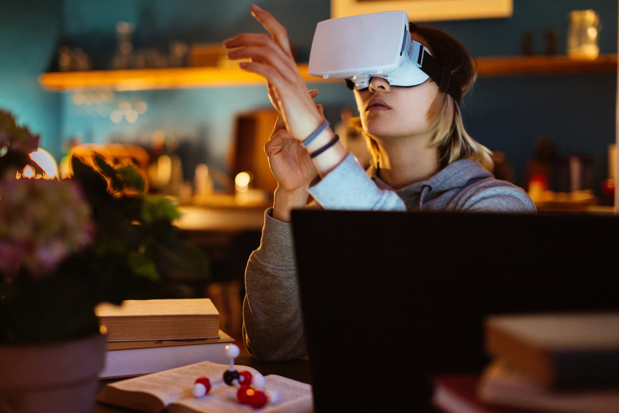 Woman using a virtual reality headset at home.