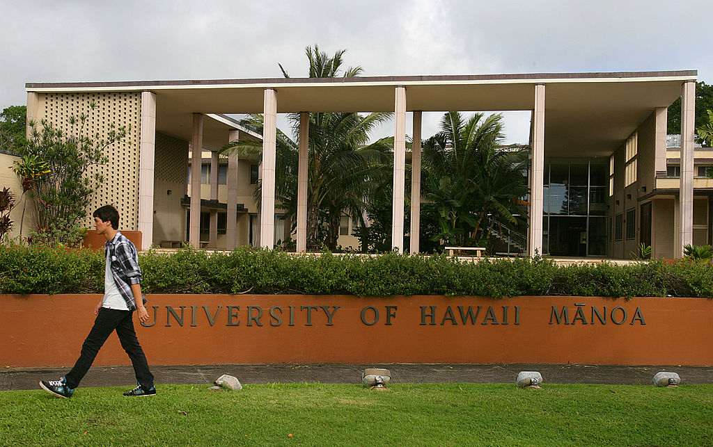 A student walks on campus at the University of Hawaii in Honolulu, Hawaii, U.S., on Wednesday, Jan. 9, 2013. Honolulu, the southernmost major U.S. city, is a major financial center of the islands of the Pacific Ocean.