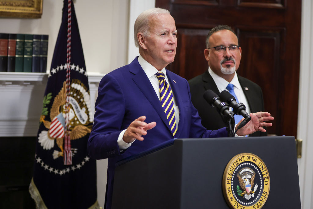 WASHINGTON, DC - AUGUST 24: U.S. President Joe Biden, joined by Education Secretary Miguel Cardona, speaks on student loan debt in the Roosevelt Room of the White House August 24, 2022 in Washington, DC. President Biden announced steps to forgive $10,000 in student loan debt for borrowers who make less than $125,000 per year and cap payments at 5 percent of monthly income.