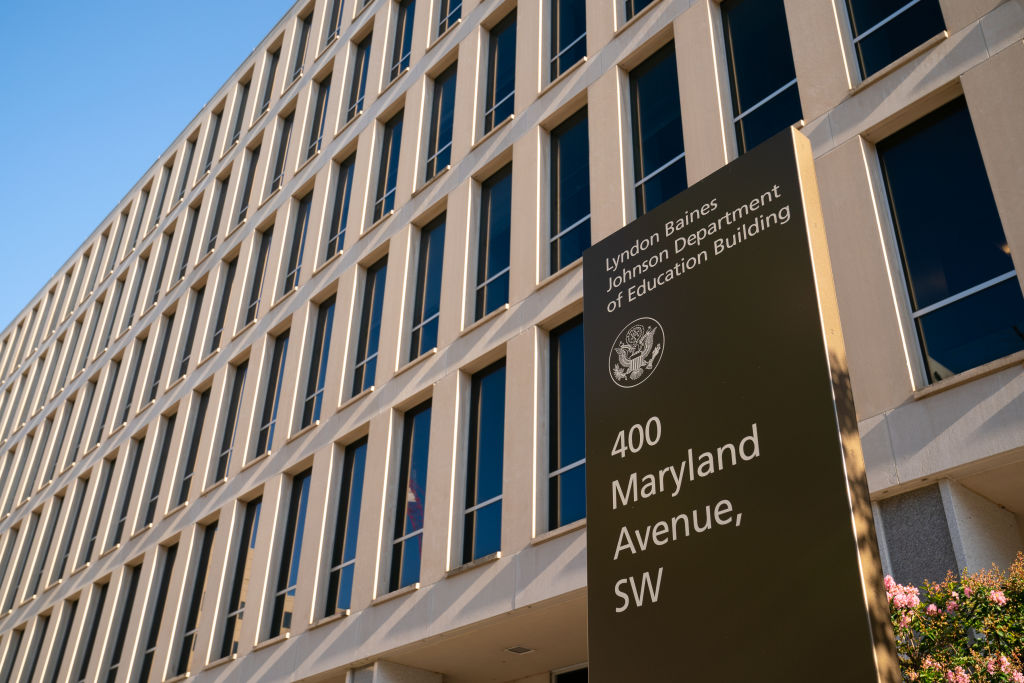 The exterior of the U.S. Department of Education building in Washington, DC, on a clear sunny day.