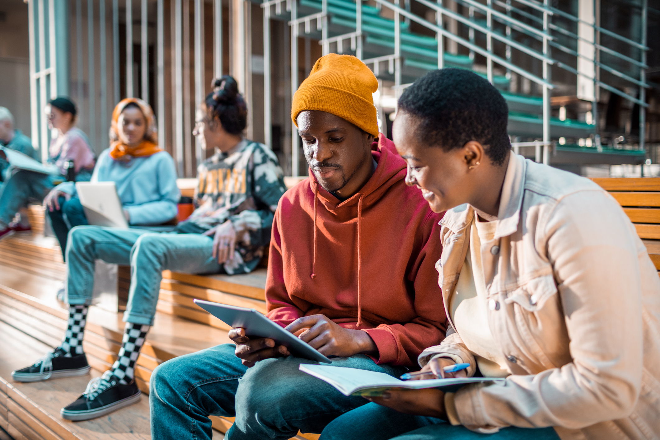 Close up of a group of students socializing in the lobby of the university