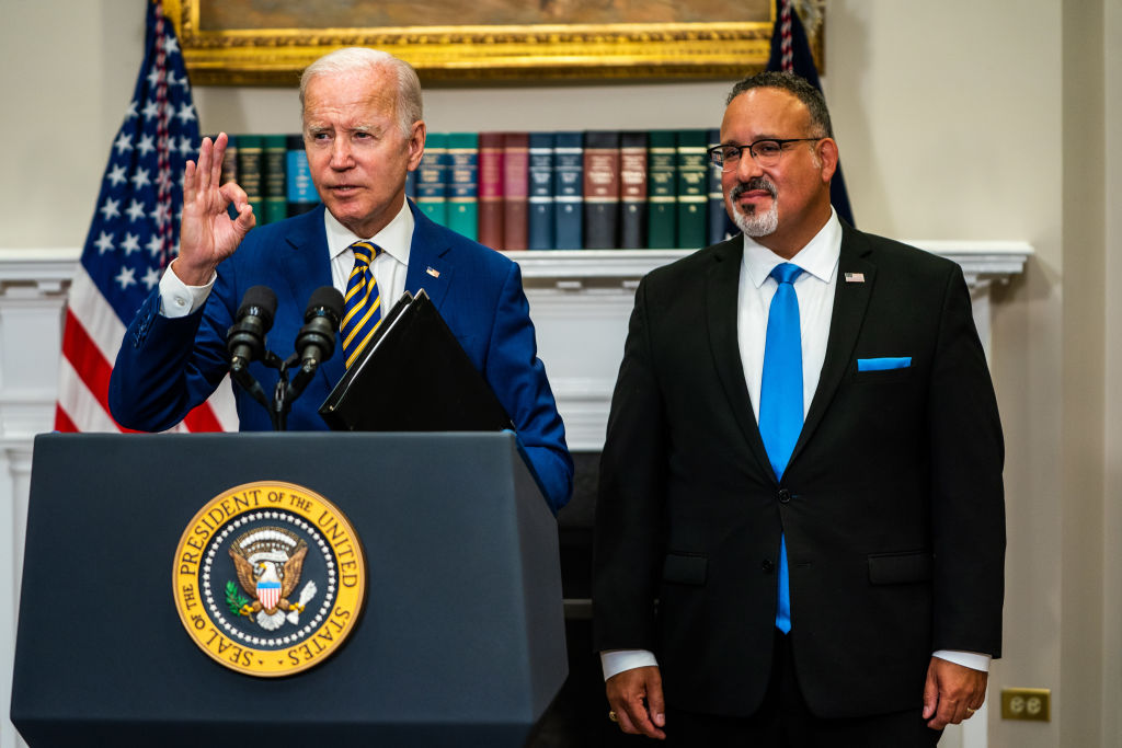 US President Joe Biden delivers remarks regarding student loan debt forgiveness in the Roosevelt Room of the White House on Wednesday August 24, 2022. Education Secretary Miguel Cardona joined.