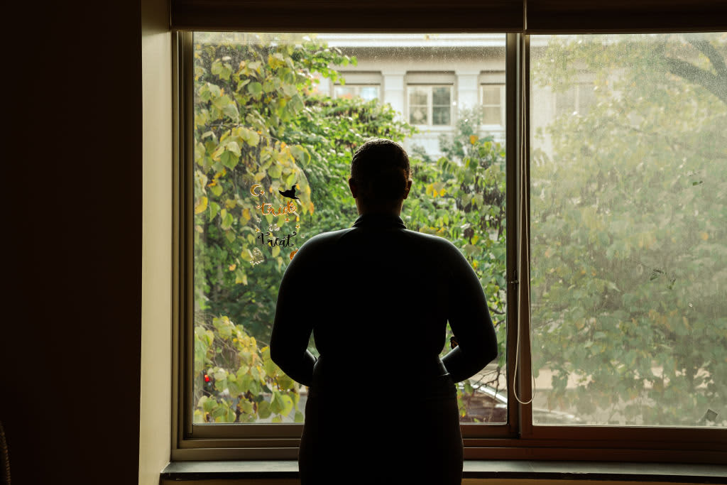 Mackenzie, a senior student at American University originally from Texas, stands for a portrait in her college dormitory building in Washington, DC on October 30, 2021.