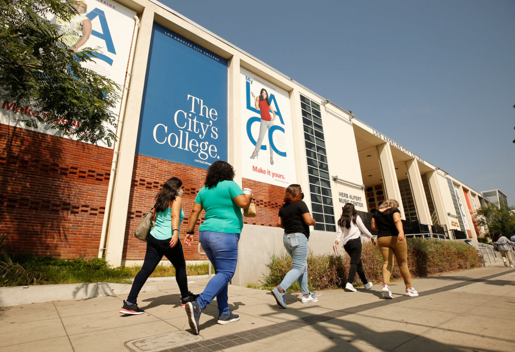 LOS ANGELES, CA - AUGUST 30: Adult students in the English as a second language class make their way on The Los Angeles Community College campus as a portion of the enrolled student body returns to in-class instruction for the reopening on Monday August 30th of Los Angeles City College (LACC) in the LACCD, the nation's largest community college district. School will look a bit different this year, as masks will be required on-campus. A majority of students at LACC are continuing with online classes for this Fall semester. LA City College on Monday, Aug. 30, 2021 in Los Angeles, CA.
