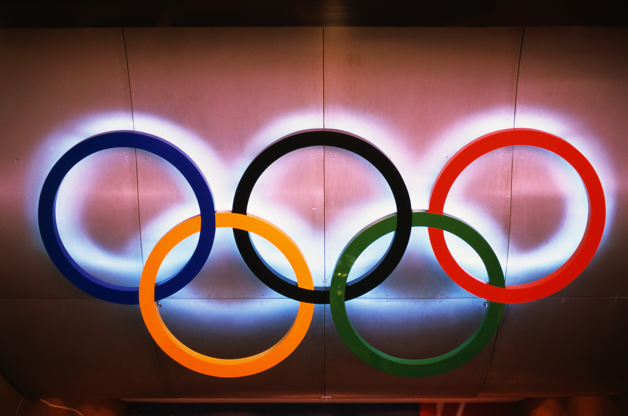 A lighted sculpture of the Olympic rings is installed over the doorway of the Olympic Store at the Syndey 2000 Olympic site.