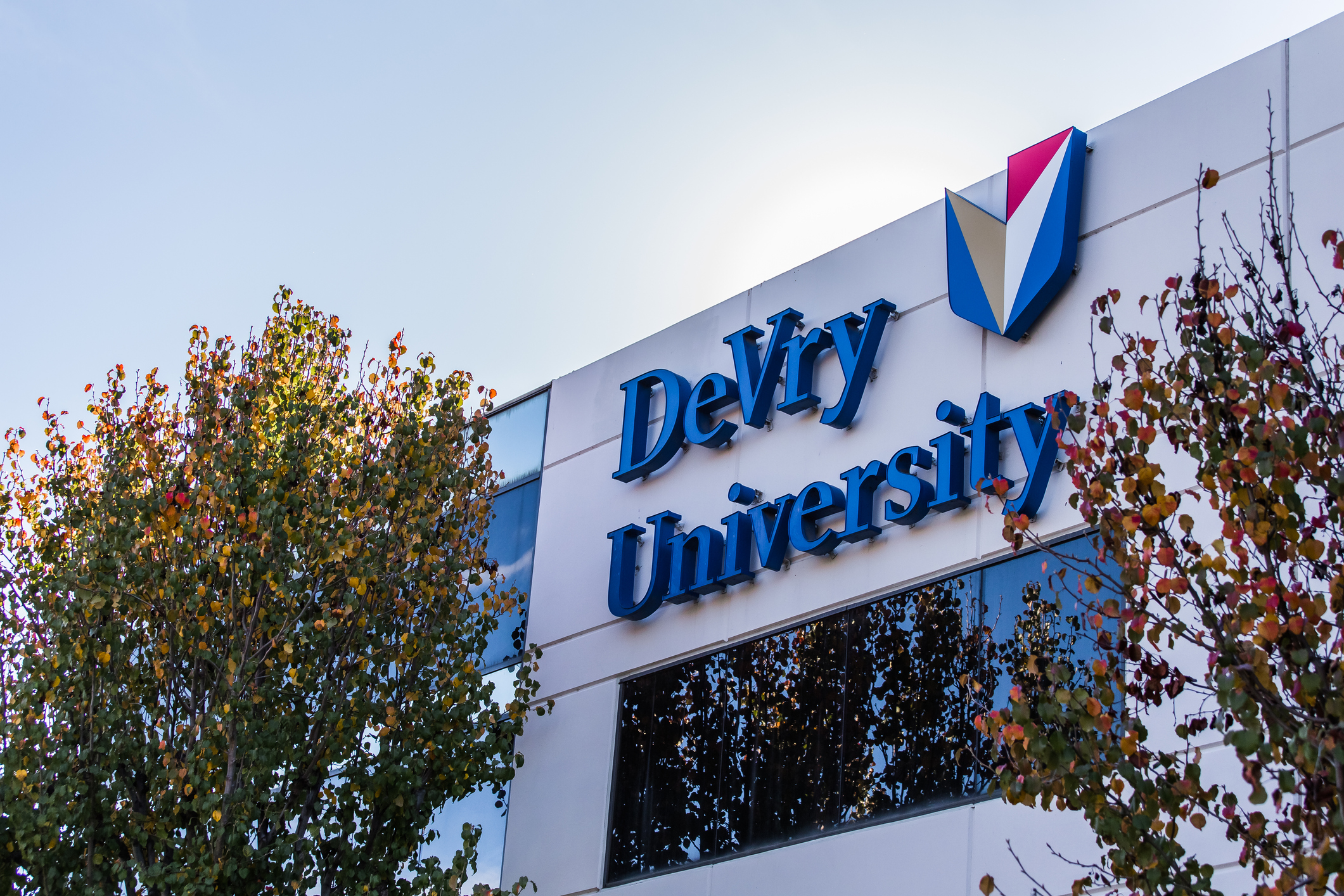 Pomona, California - USA - December 20, 2016: DeVry University sign on its building during settlement. During the week of troubles for the school, DeVry University, a for-profit school that offers courses online and at dozens of locations nationwide, has agreed to a $100 million settlement of a federal lawsuit alleging that it falsely advertised the success of its graduates, the Federal Trade Commission announced on Thursday.