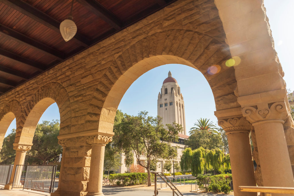 Stanford University's Hoover Tower, taken by the arches of the Main Quadrangle on campus in the morning.