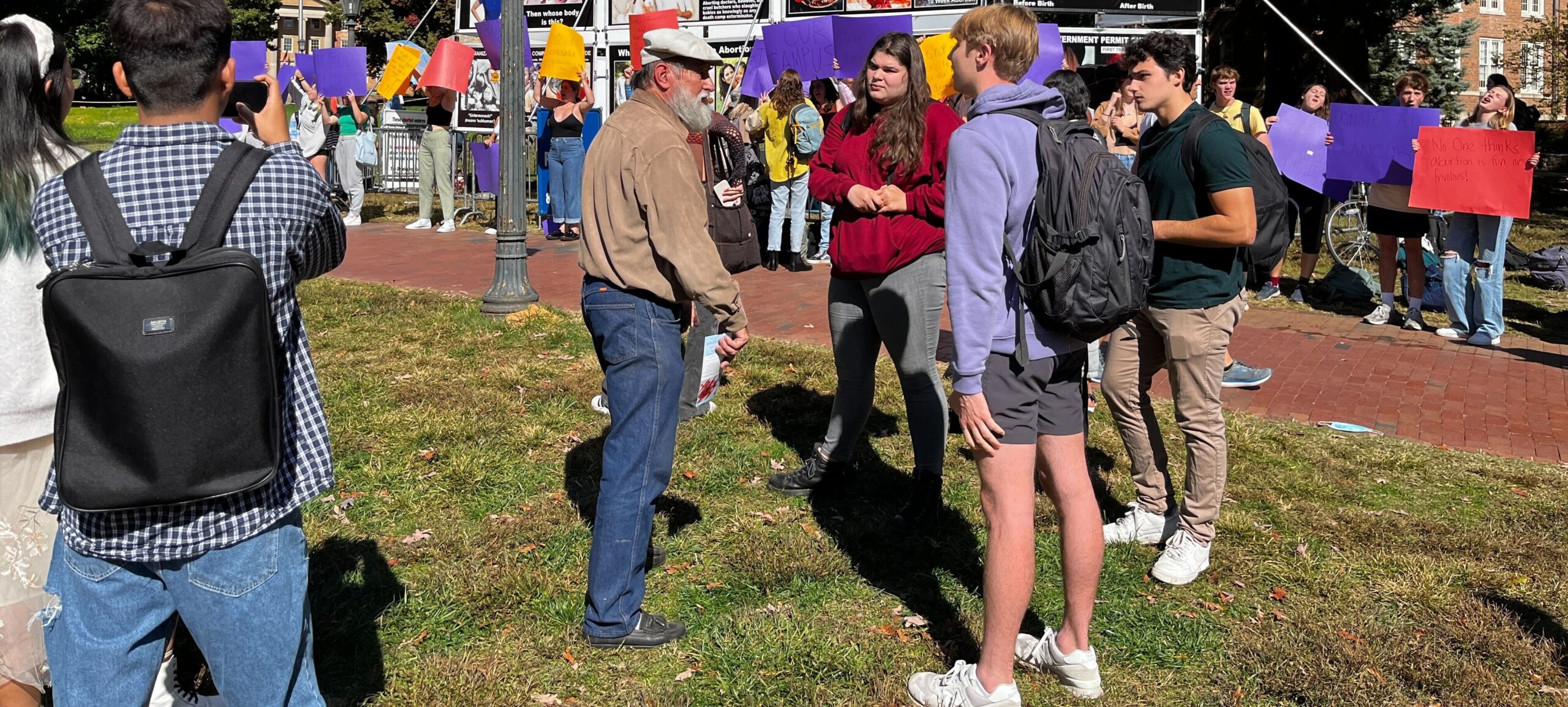 Students gather at McCorkle Place on the University of North Carolina at Chapel Hill to protest a series of graphic anti-abortion billboards displayed on campus.