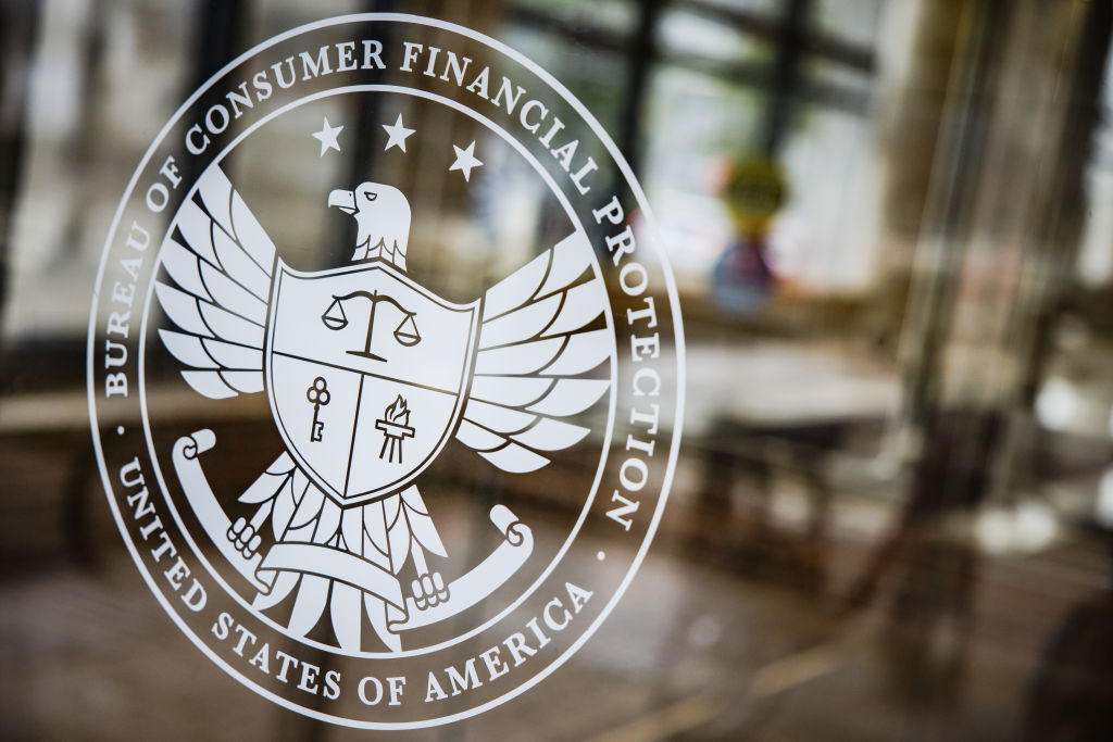 A seal at the Consumer Financial Protection Bureau (CFPB) headquarters in Washington, D.C., U.S., on Saturday, April 16, 2022. The Credit-reporting company TransUnion is an "out-of-control" repeat offender engaging in deceptive marketing practices the CFPB alleged this week after filing a lawsuit. Photographer: Samuel Corum/Bloomberg via Getty Images