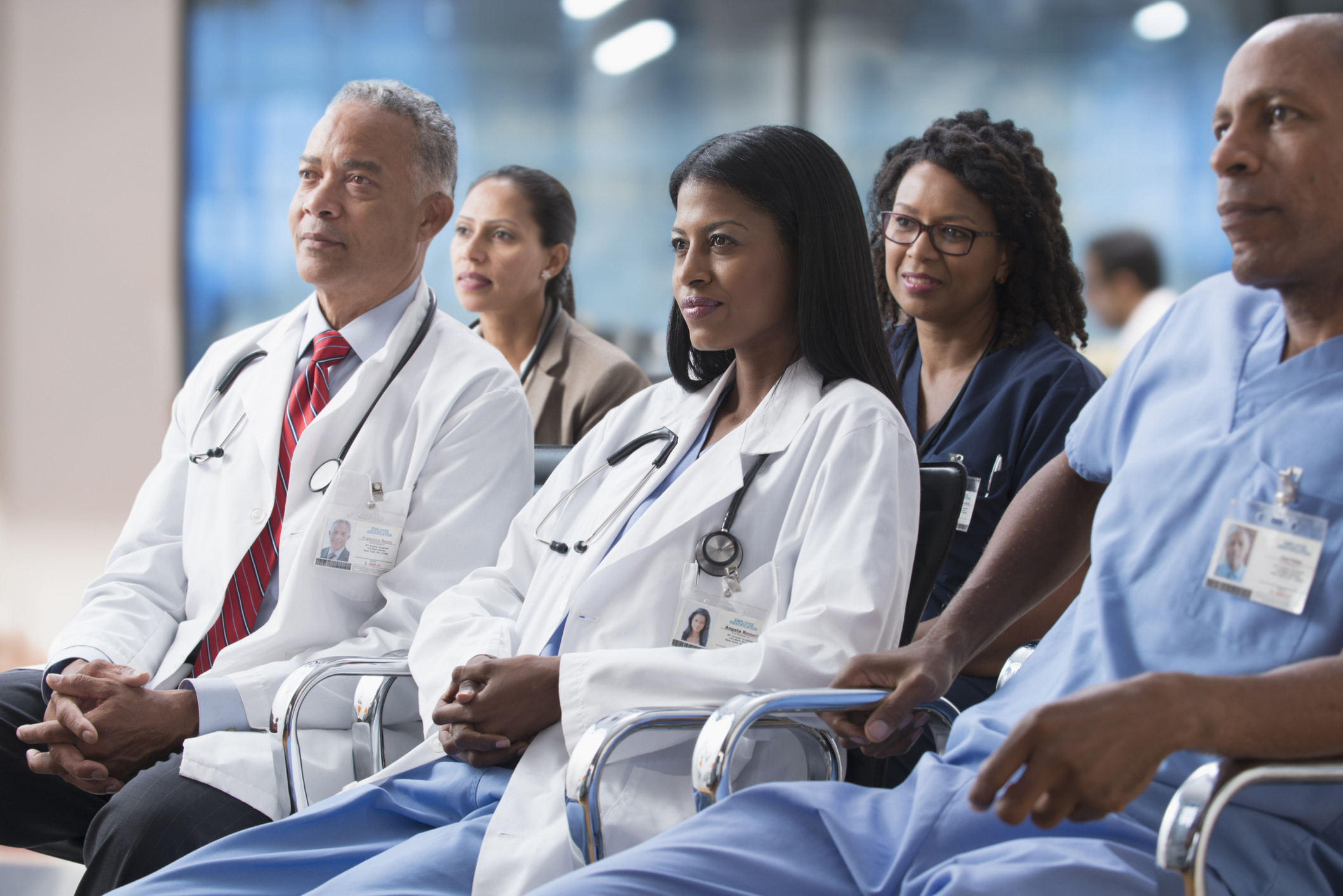 Doctors listening to presentation at conference