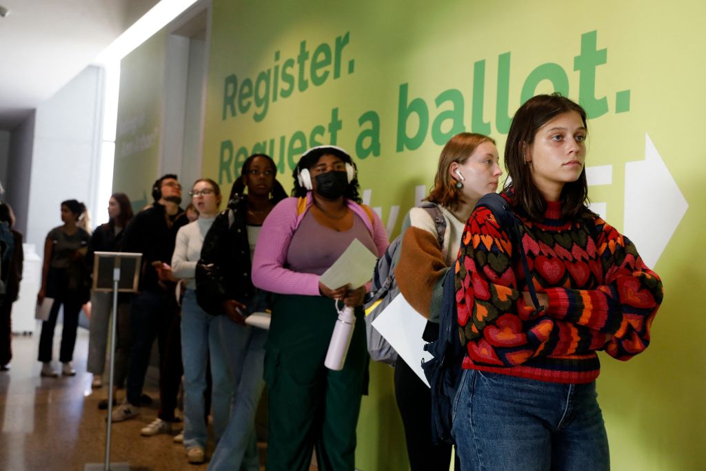 People line up to cast their early ballots for the 2022 general election at the Ann Arbor, Michigan city clerk's satellite office on the campus of the University of Michigan, on the eve of the US midterm elections, on November 7, 2022. (Photo by JEFF KOWALSKY / AFP) (Photo by JEFF KOWALSKY/AFP via Getty Images)