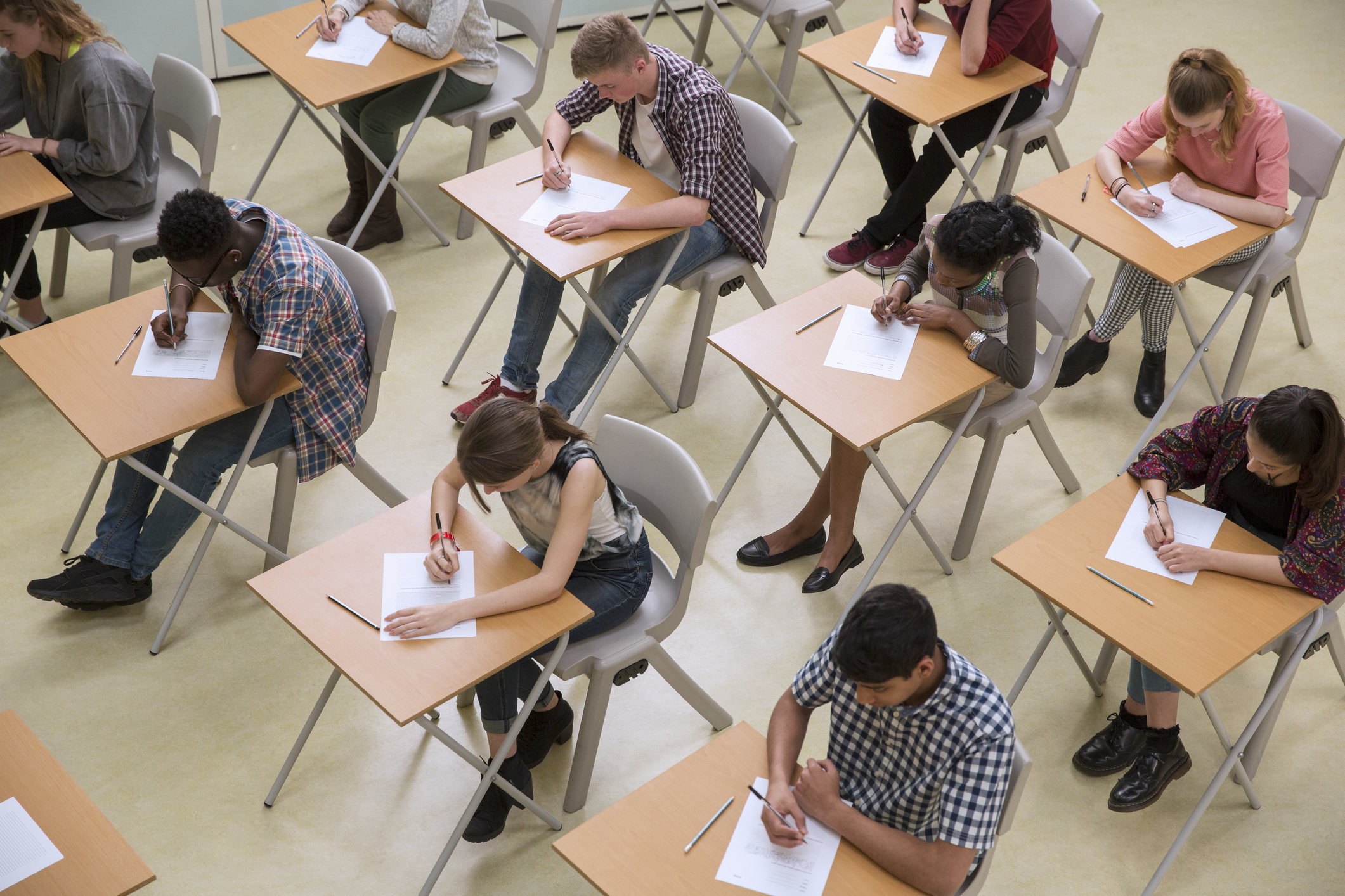 Overhead view of a classroom full of high school students taking the ACT test.