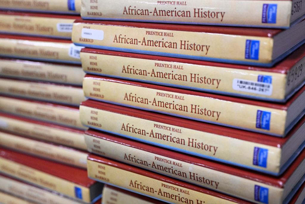 A stack of African-American history textbooks piled up in a classroom for students taking AP African-American Studies.