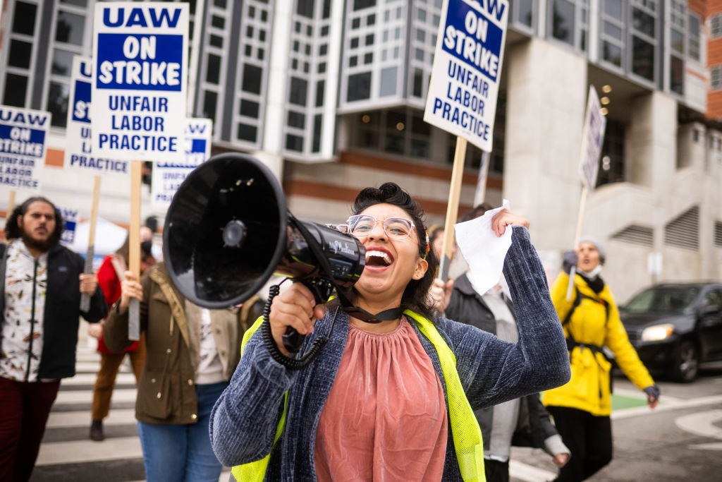 Los Angeles, CA - December 01:Gloria Bartolo, a 2nd year molecular biology PhD student, leads marching UCLA postdoctoral scholars and academic researchers in Westwood as they demand better wages, student housing, child care and more with University of California on Thursday, December 1, 2022 as contract negotiations continue and thousands strike. (Photo by Sarah Reingewirtz/MediaNews Group/Los Angeles Daily News via Getty Images)