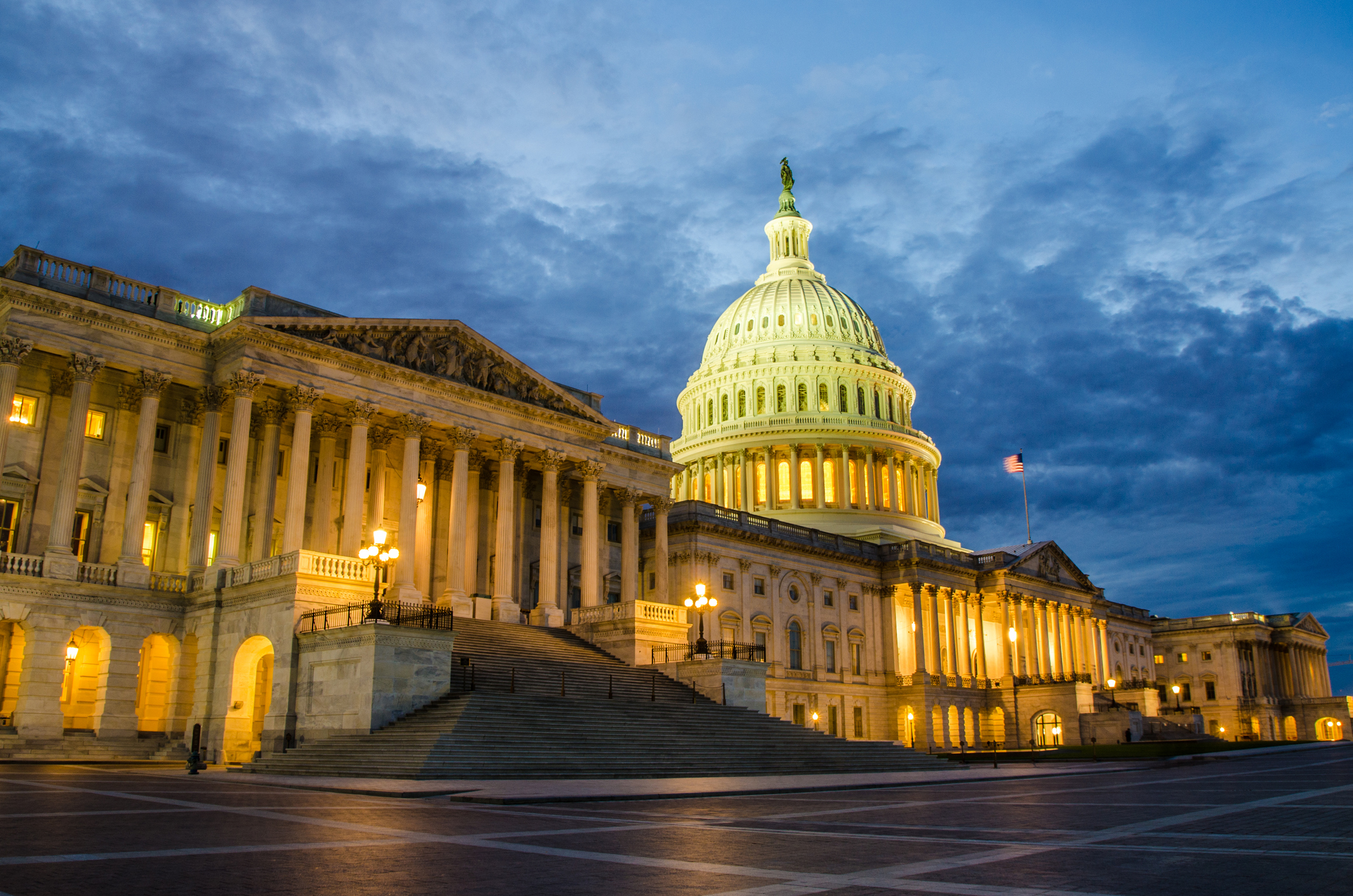 Front facade of Washington DC Capitol at night during summer