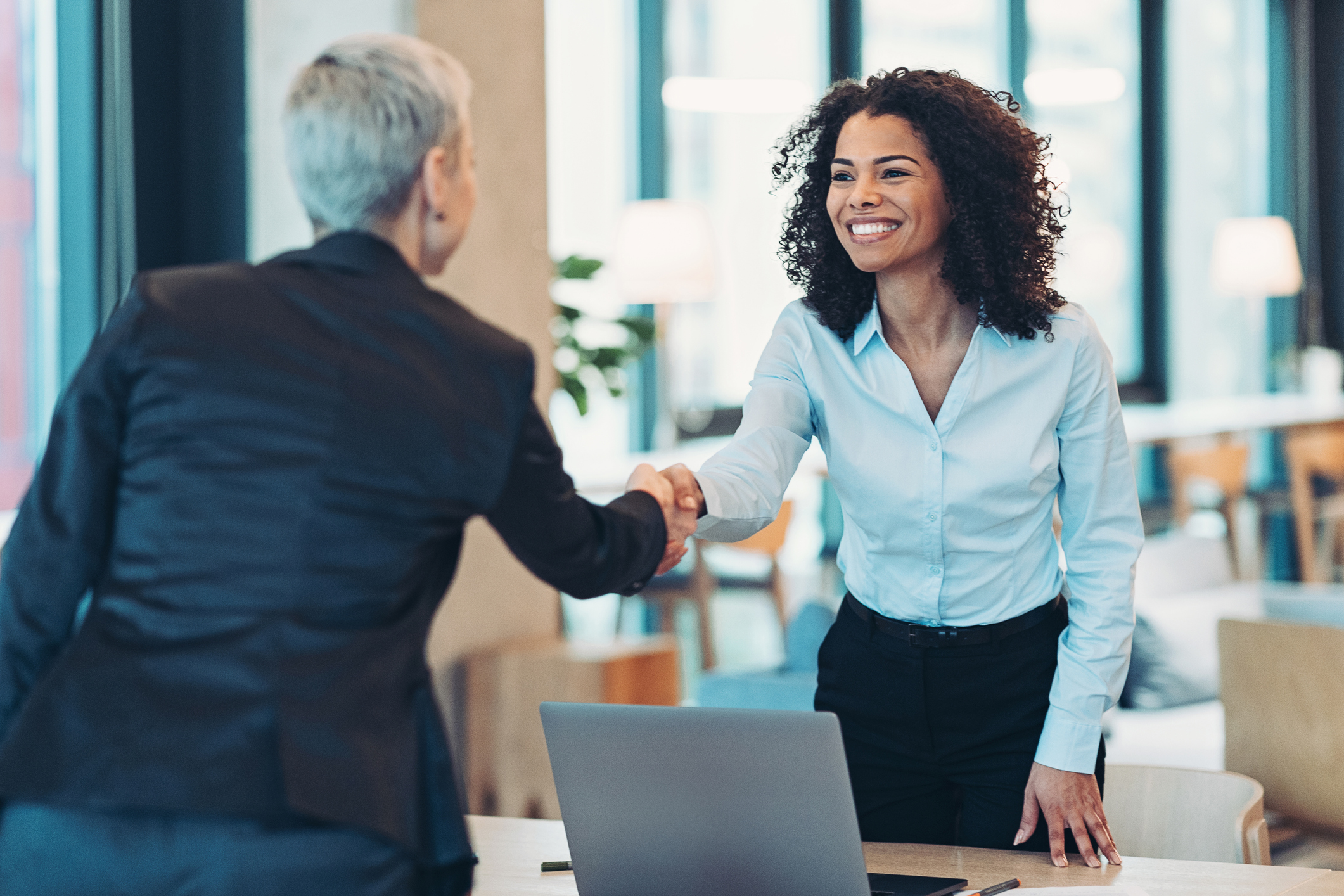 Businesswomen shaking hands in the office