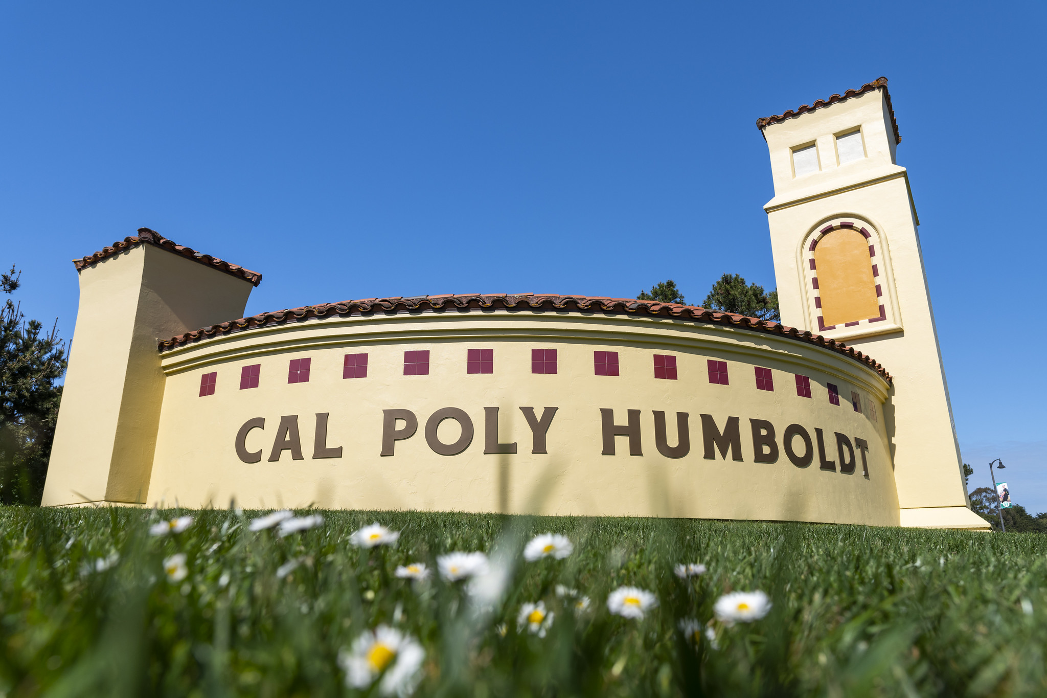 Photo of a sign on Cal Poly Humboldt campus that ssays "Cal Poly Humboldt".