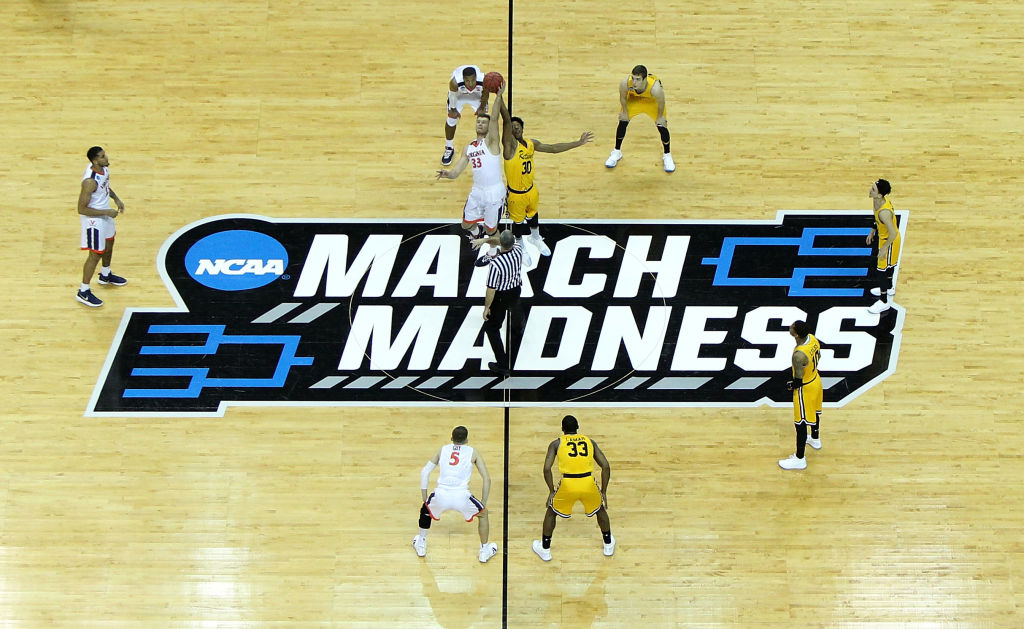 CHARLOTTE, NC - MARCH 16: The Virginia Cavaliers tip off against the UMBC Retrievers in the first round of the 2018 NCAA Men's Basketball Tournament at Spectrum Center on March 16, 2018 in Charlotte, North Carolina. (Photo by Streeter Lecka/Getty Images)