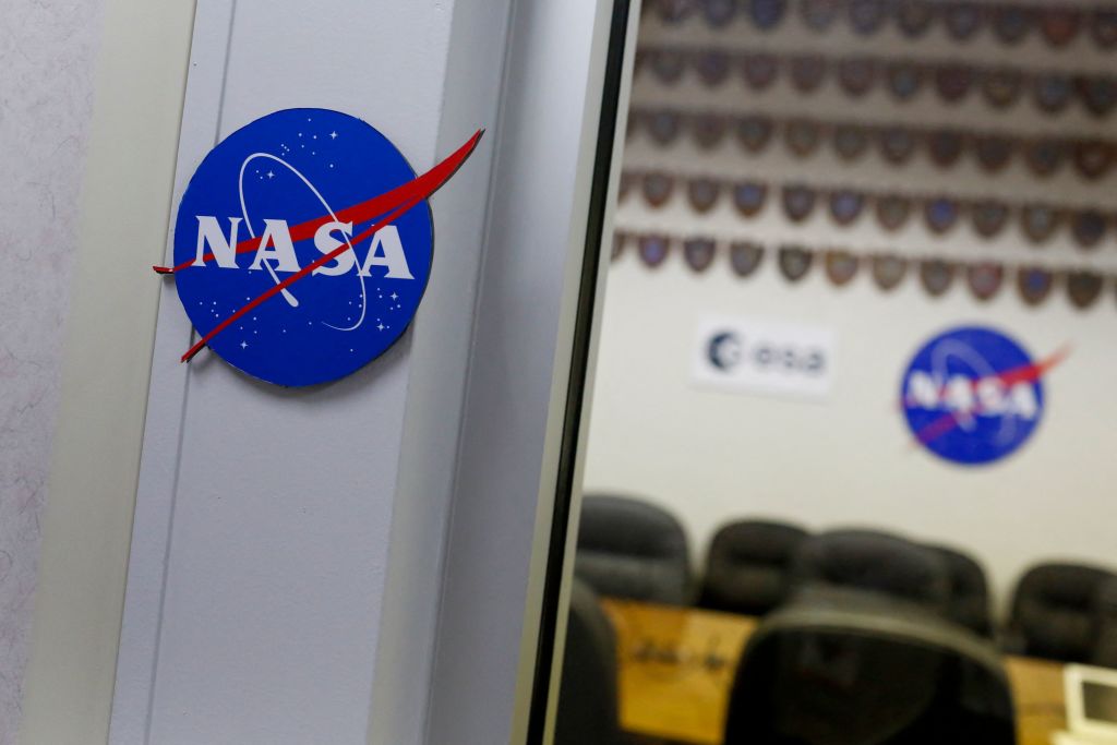 NASA logos are seen in the conference room of the Astronaut Crew Quarters (ACQ) at Kennedy Space Center, in Cape Canaveral, Florida, on June 14, 2022. - NASA's Kennedy Space Center in Florida has played a leading role in the American space program for 60 years. The Launch Operations Center was first established in July 1962, and renamed the John F. Kennedy Space Center in December 1963. (Photo by Eva Marie UZCATEGUI / AFP) (Photo by EVA MARIE UZCATEGUI/AFP via Getty Images)