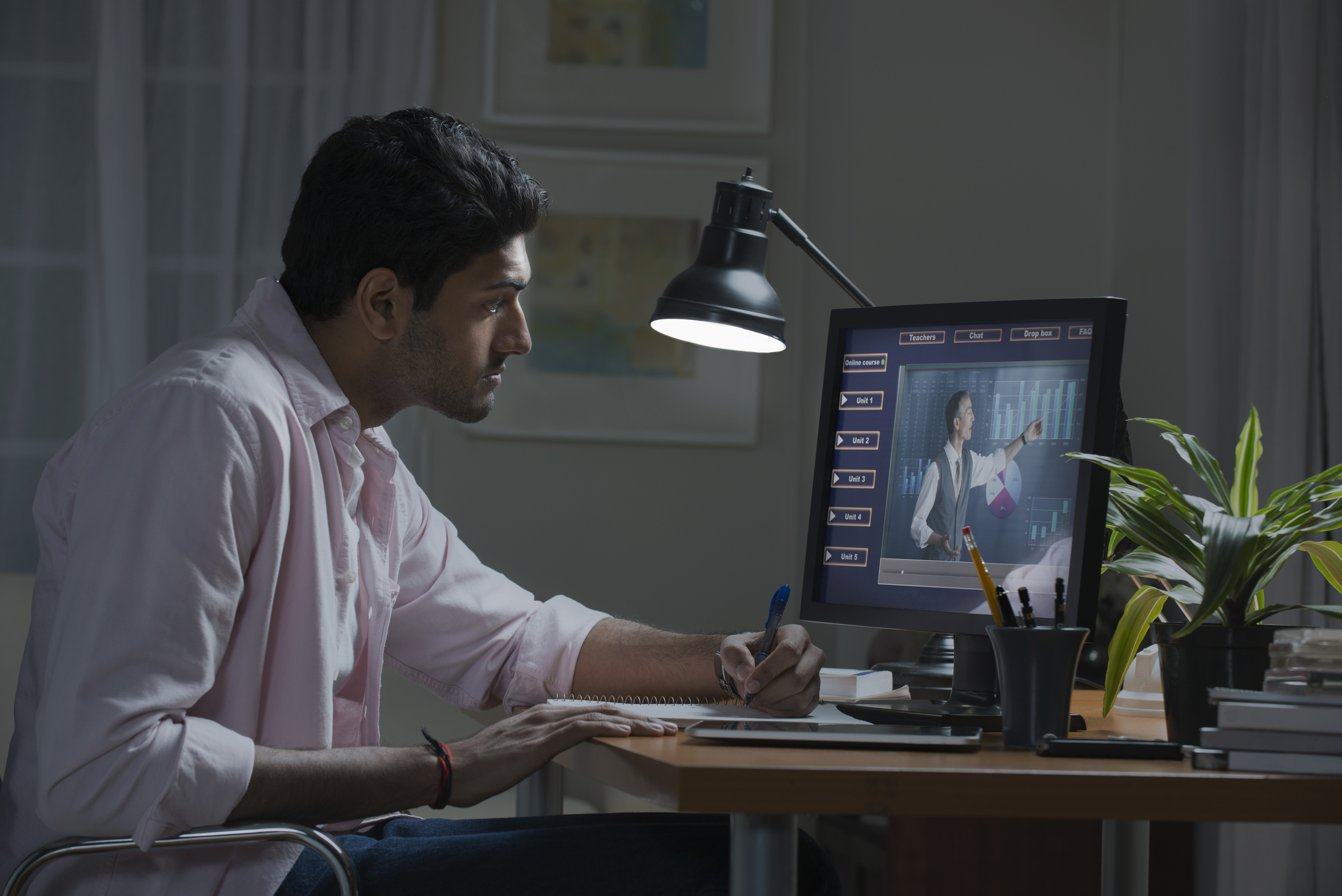 Businessman working at desk at home