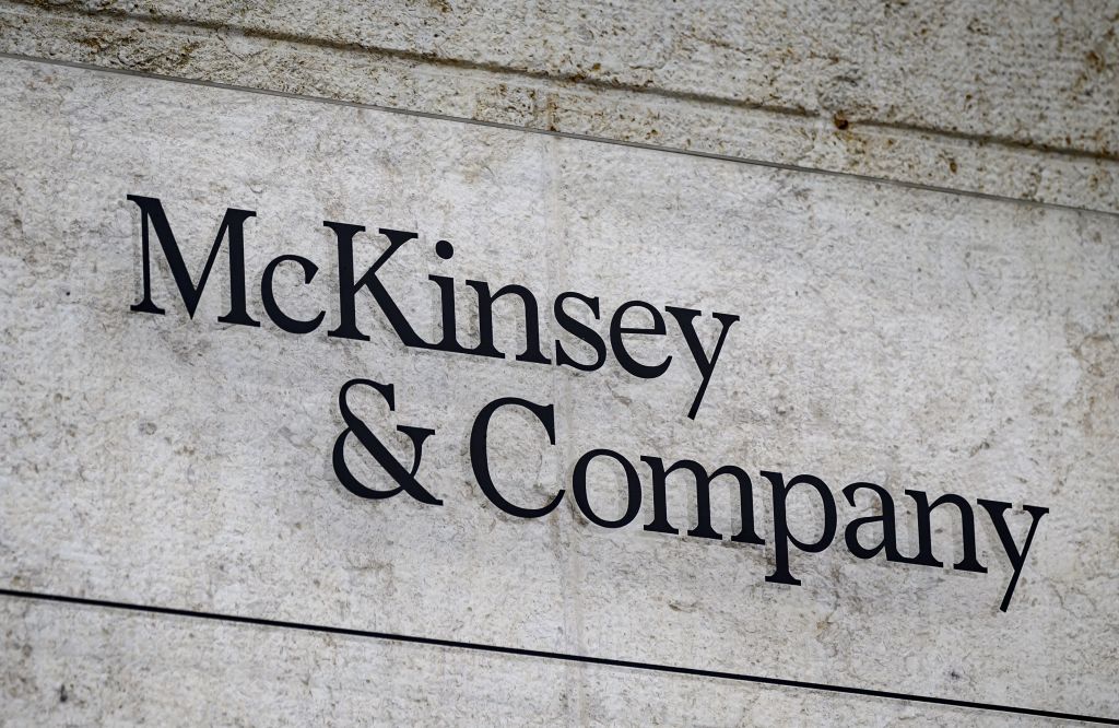 US-based McKinsey & Company's logo inn a sign on the exterior of a building.