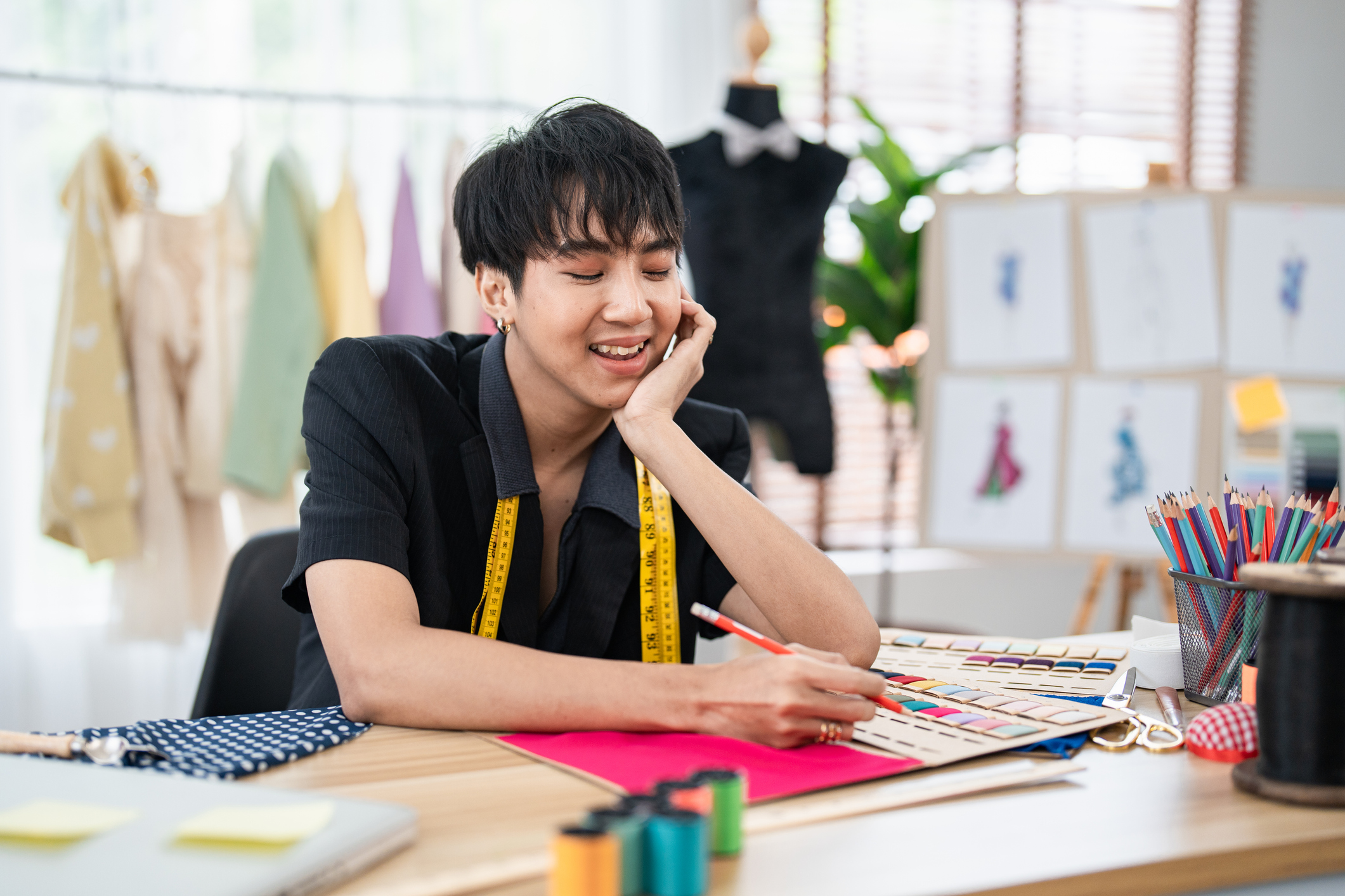 Portrait of Young Confident Fashion Designer at Design Studio