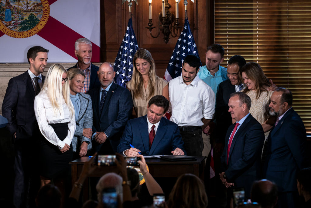 Florida Governor Ron DeSantis signs three education bills on the campus of New College of Florida in Sarasota, Fla.