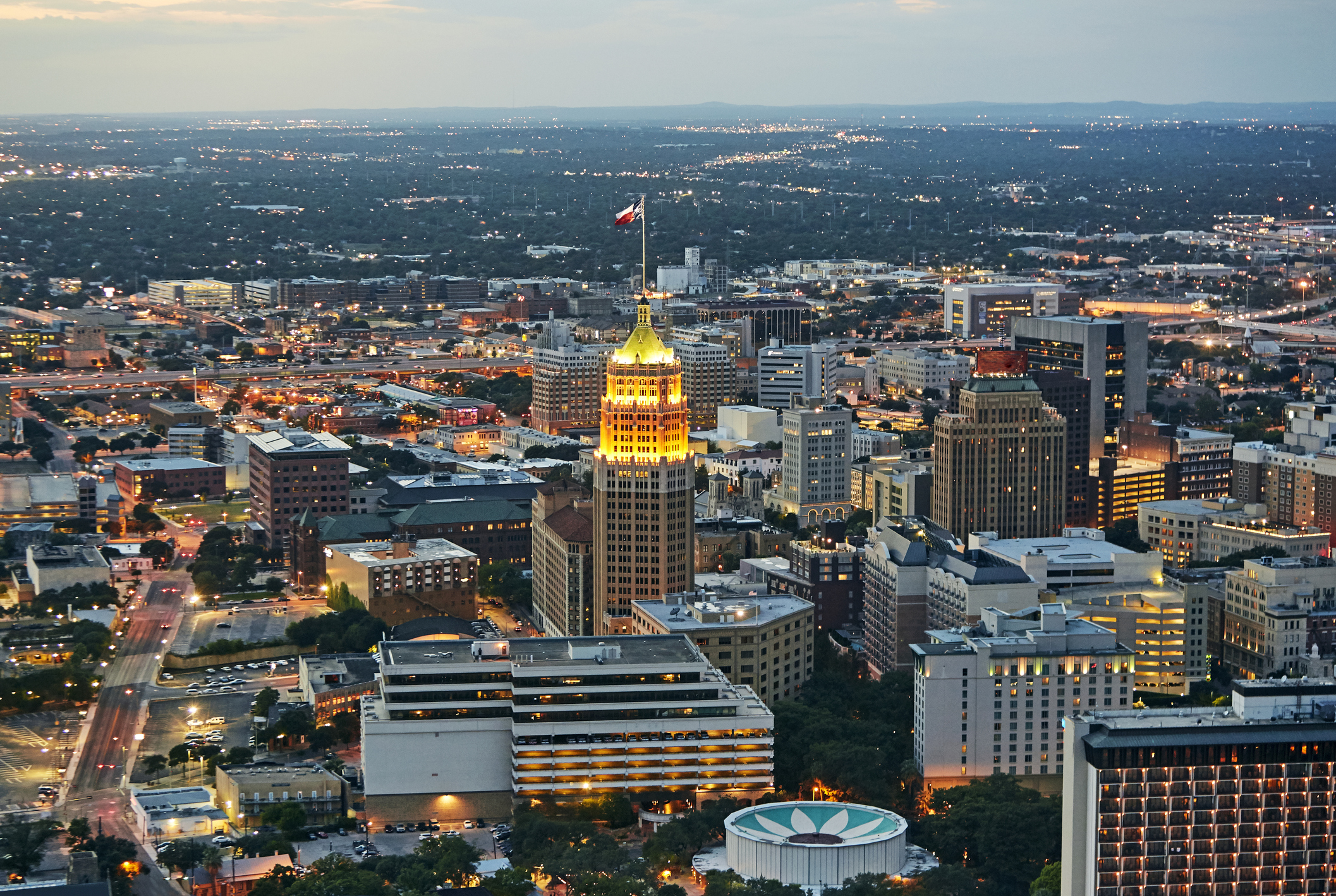 Aerial view of San Antonio illuminated at dusk