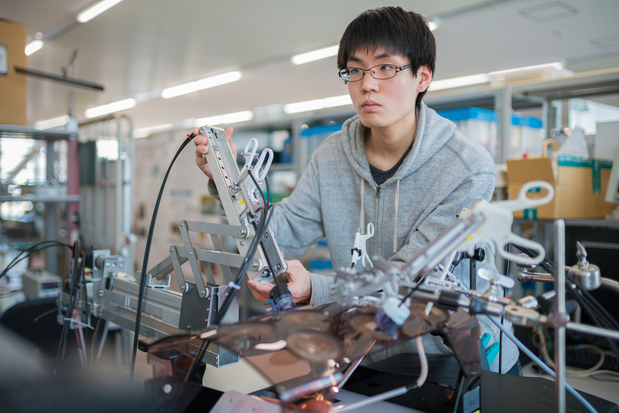 Engineering student working on a medical machine