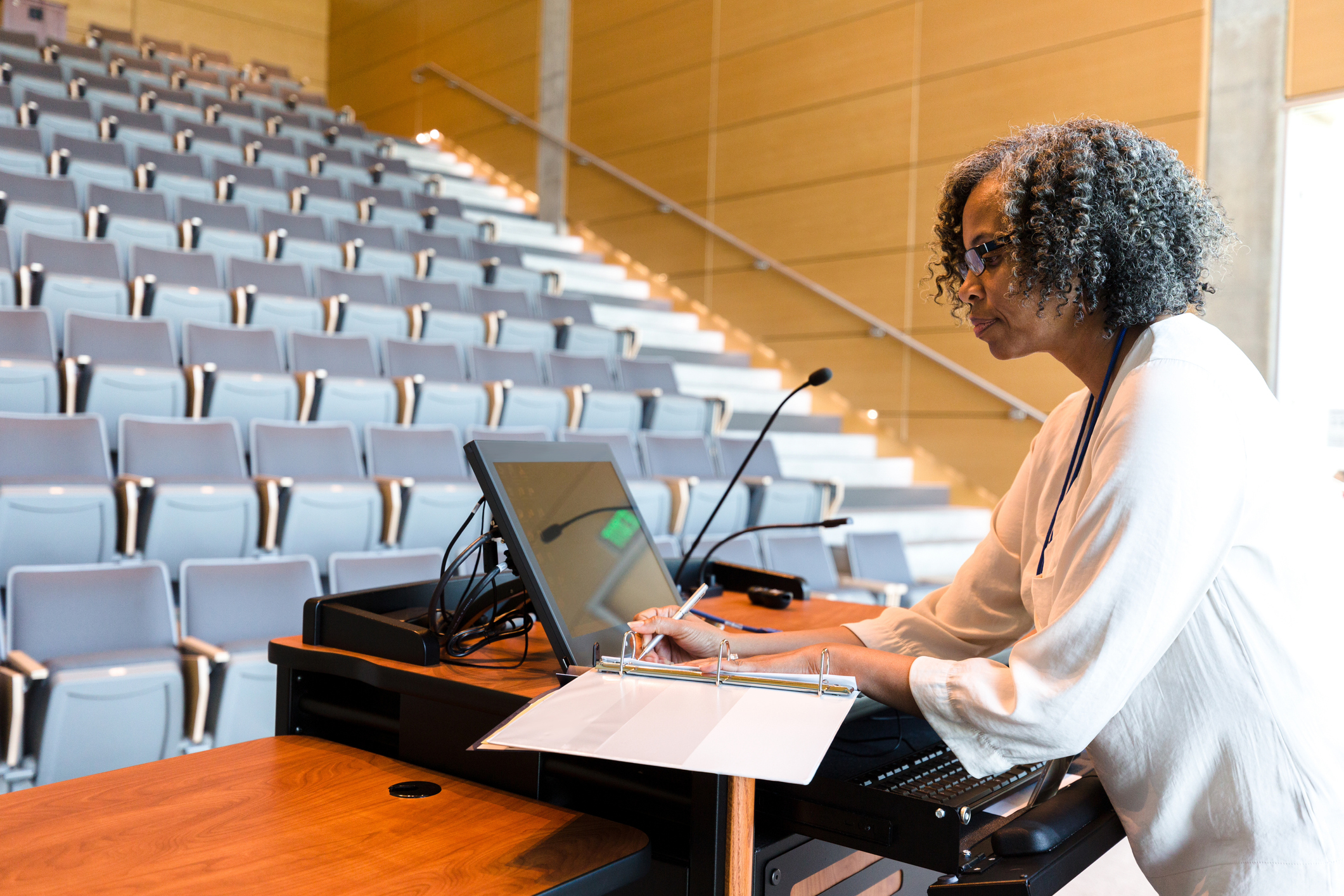 Mature female college professor preparing for lecture